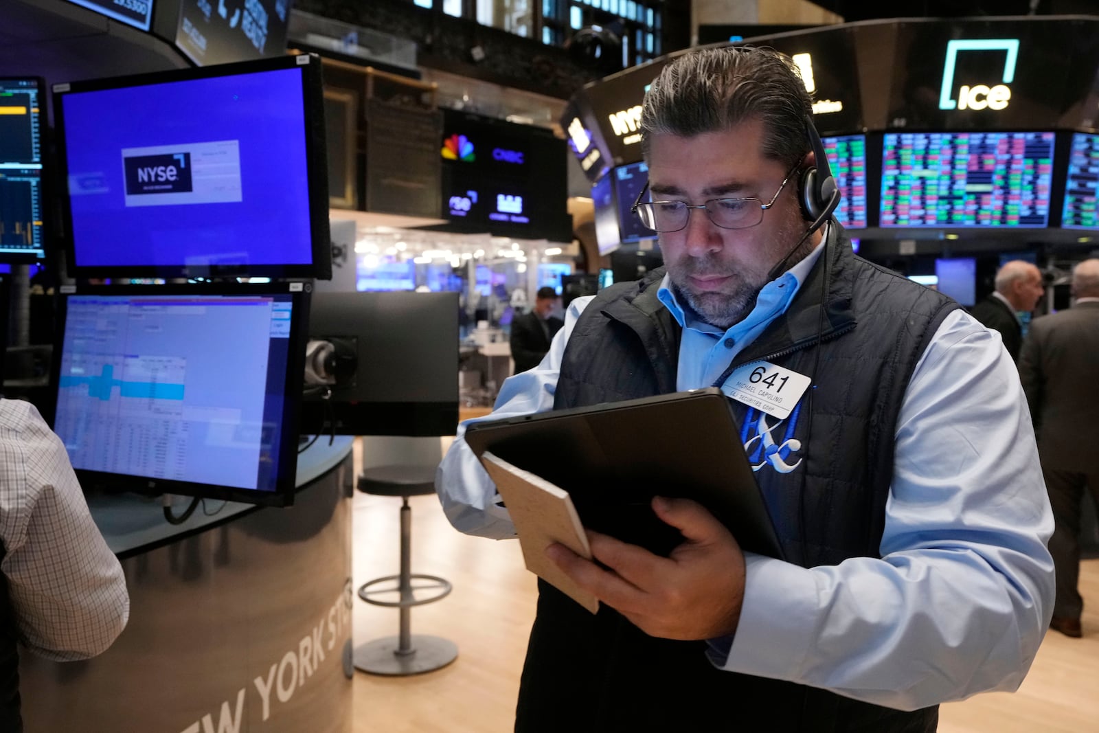 Trader Michael Capolino works on the floor of the New York Stock Exchange, Monday, Nov. 4, 2024. (AP Photo/Richard Drew)