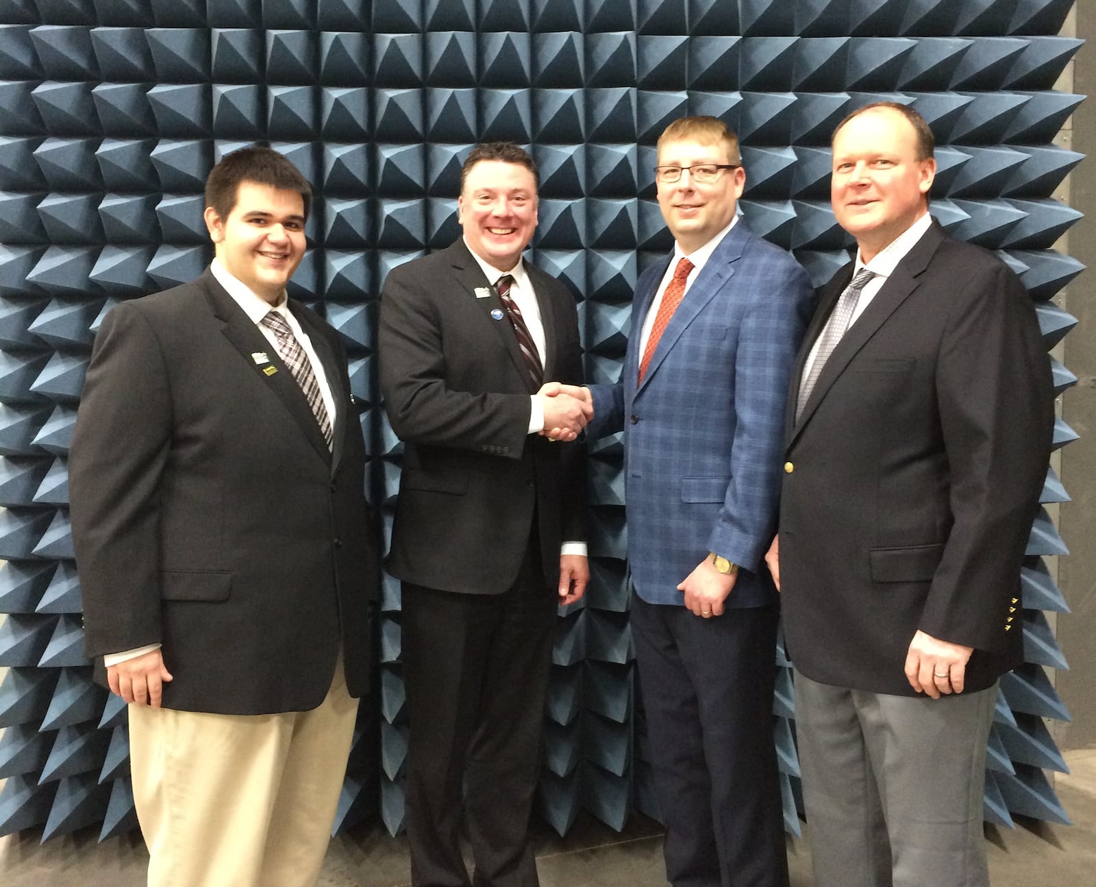 Max McConnell (left) and Paul Newman Jr. (center-left) of Greene County Development met with Resonant Sciences President J. Micah North (center-right) and Vice President Ron Miller (right) in Resonant’s Antenna & Radome Measurement Chamber.