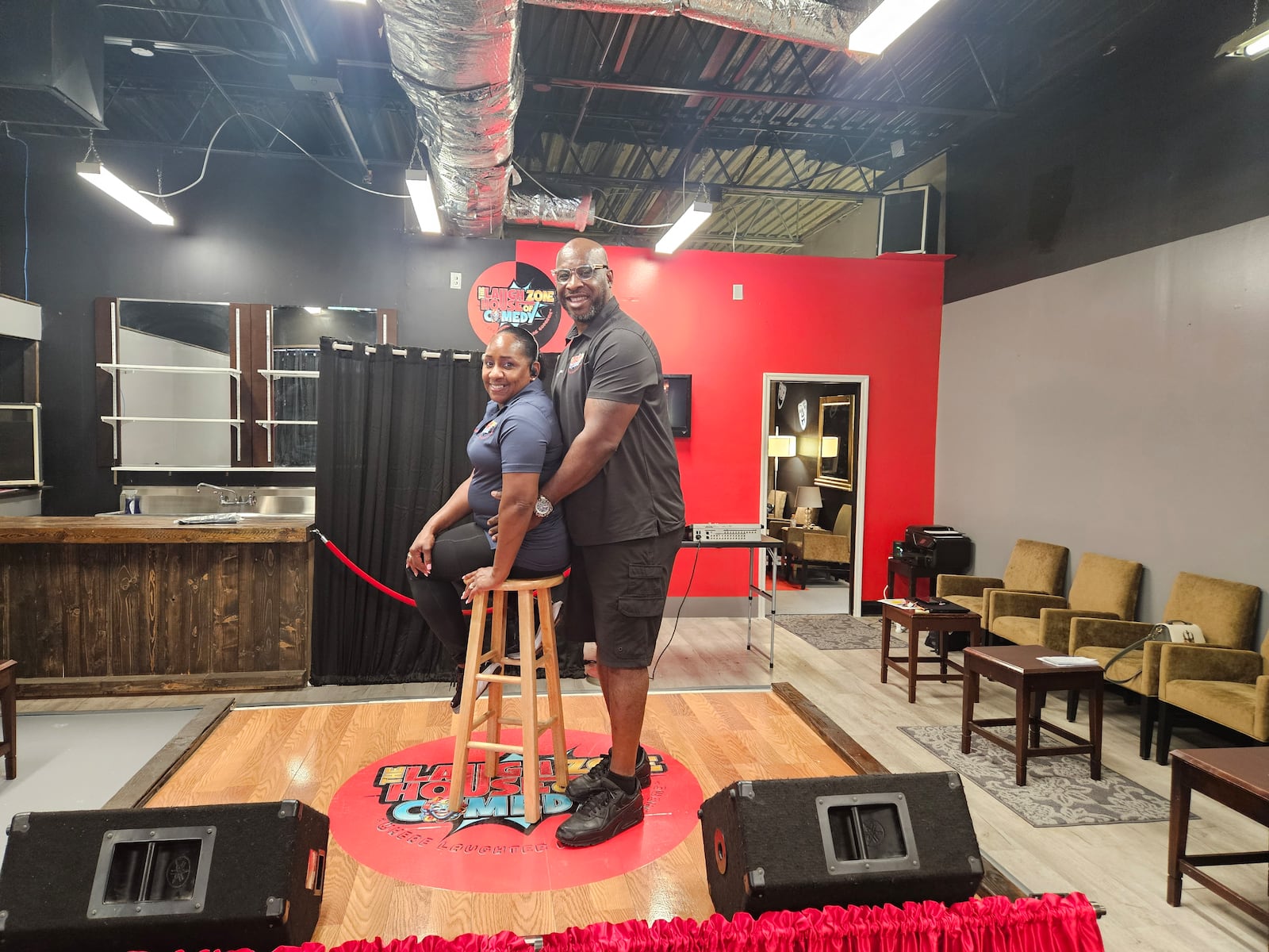 C.O.O. Tony Sanders and Khonda Sanders, general manager, on stage at The Laugh Zone House of Comedy. CONTRIBUTED/JESSICA GRAUE