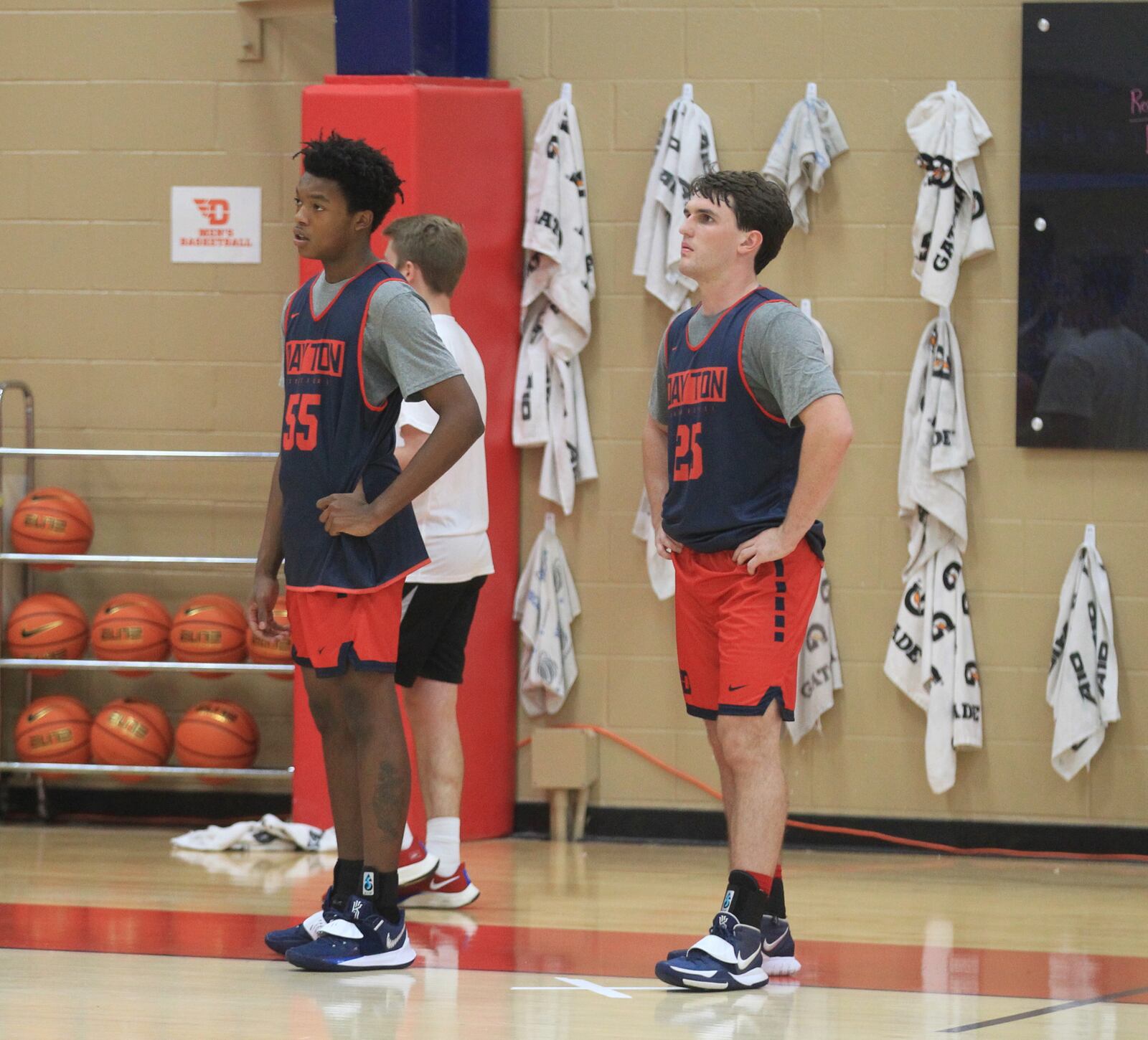 Dayton walk-ons Justin Lovette, left, and Brady Uhl watch practice on Thursday, Oct. 7, 2021, at the Cronin Center. David Jablonski/Staff