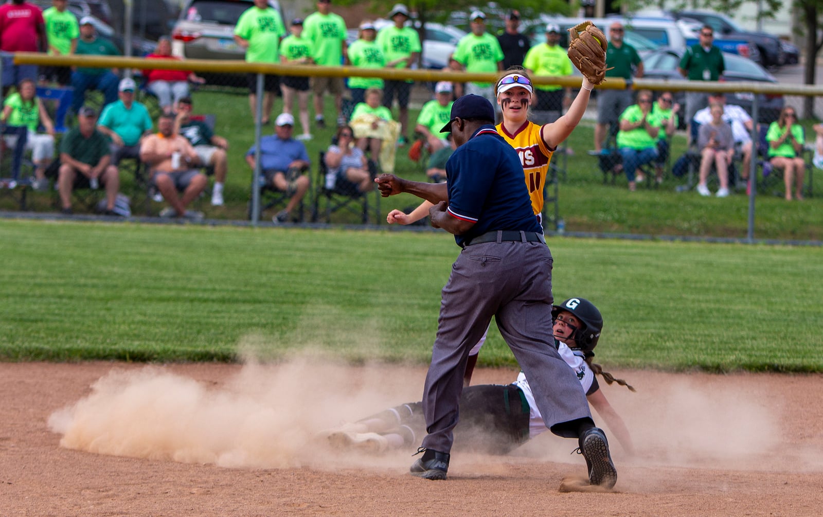 Ross shortstop Ashley Shelton reacts to tagging out Greenville's Savannah Leach, who was trying to stretch a single into a double, in the fifth inning of Friday's Division II district final at Kings High School. Greenville won 9-0. Jeff Gilbert/CONTRIBUTED