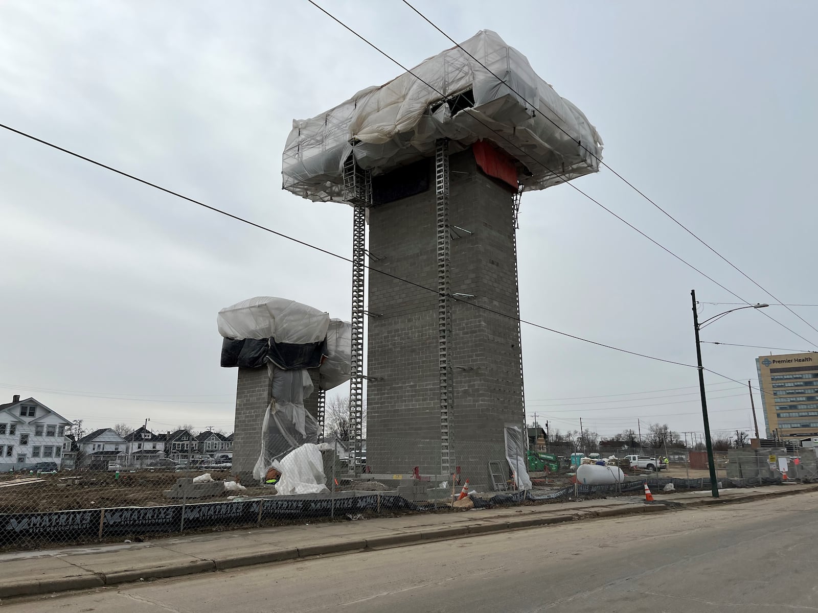 Work on The Flight apartments near the University of Dayton broke ground in late November. The elevator and stair towers for the five-story building are complete and primary utilities are being installed. CORNELIUS FROLIK / STAFF