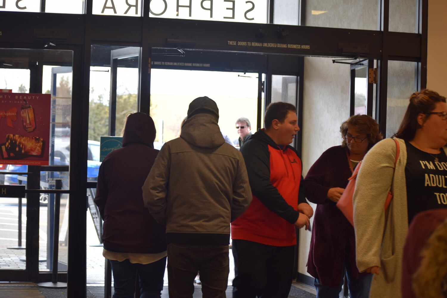 PHOTOS: Hundreds like up outside JCPenney for doorbusters, coupons