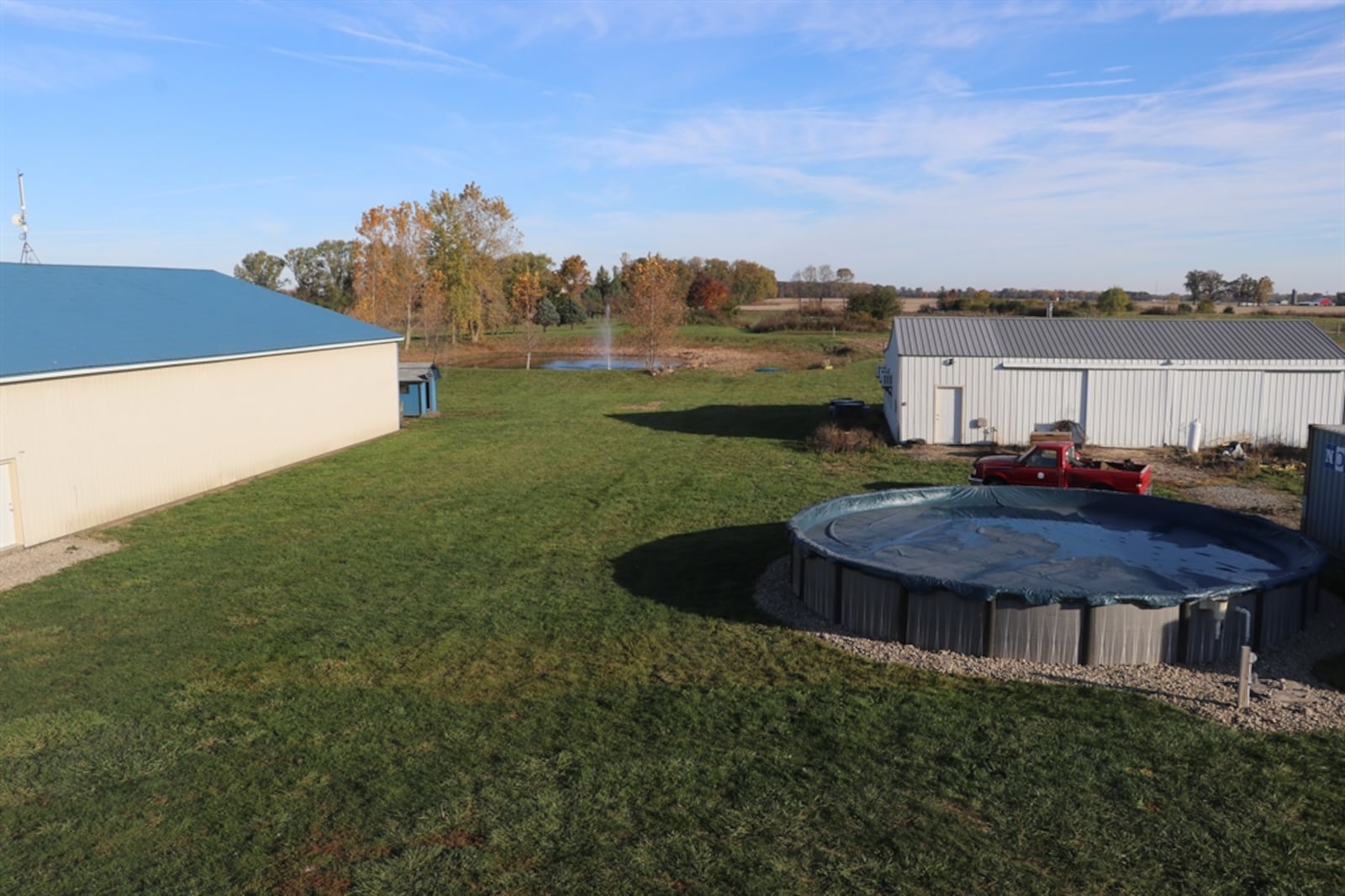 Listed for $558,950 by Berkshire Hathaway Home Services Professional Realty, the 10-acre property at 3095 E. Peterson Road in Lost Creek Twp. includes the fenced pasture, stocked pond, two pole barns, an above-ground swimming pool and a two-story house with an attached two-car garage. A gravel drive leads up from the roadway to the concrete parking near the garage as the house sits well off the road. The stalled barn with dirt floor has fencing for small livestock. CONTRIBUTED