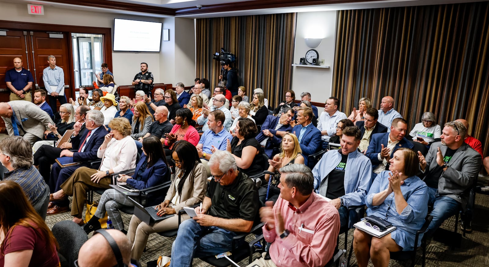 A crowd of concerned citizens filled Hamilton city council chambers for a Miami Conservancy District meeting to discuss the recent assessment increase Friday, May 3, 2024 in Hamilton. The Miami Conservancy District board adopted a resolution to rescind the revised appraisal record of benefits previously filed in March. NICK GRAHAM/STAFF