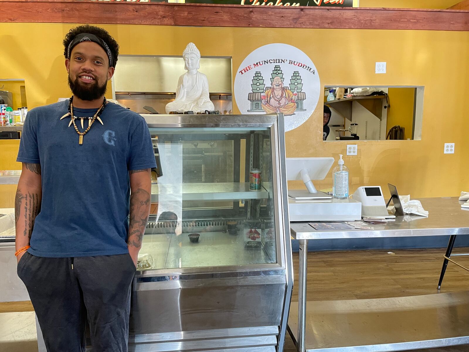 The Munchin’ Buddha, located at 100 N. James H. McGee Blvd., offers buddha (hibachi) bowls, street tacos, burgers, loaded fries and much more. Pictured is Hasohn Dillard, the owner of the restaurant. PHOTO BY NATALIE JONES