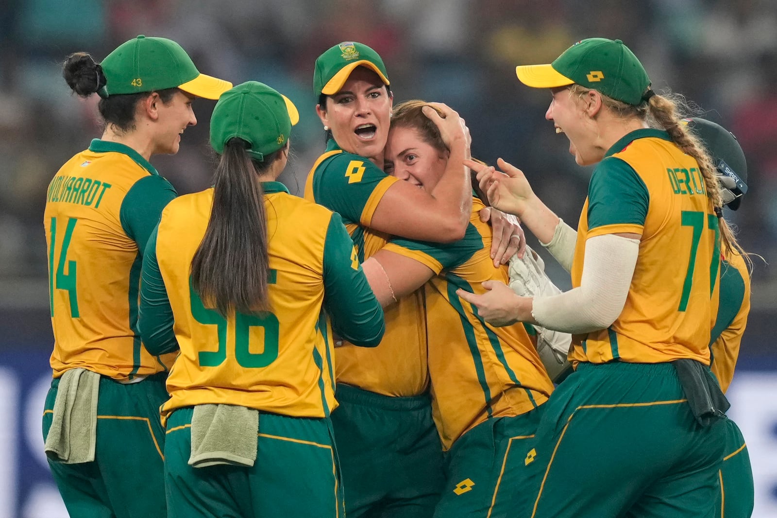 South Africa's Nadine de Klerk, center, without a cap, celebrates with teammates the wicket of New Zealand's captain Sophie Devine during the ICC Women's T20 World Cup 2024 final match between New Zealand and South Africa at Dubai, United Arab Emirates, Sunday, Oct. 20, 2024. (AP Photo/Altaf Qadri)