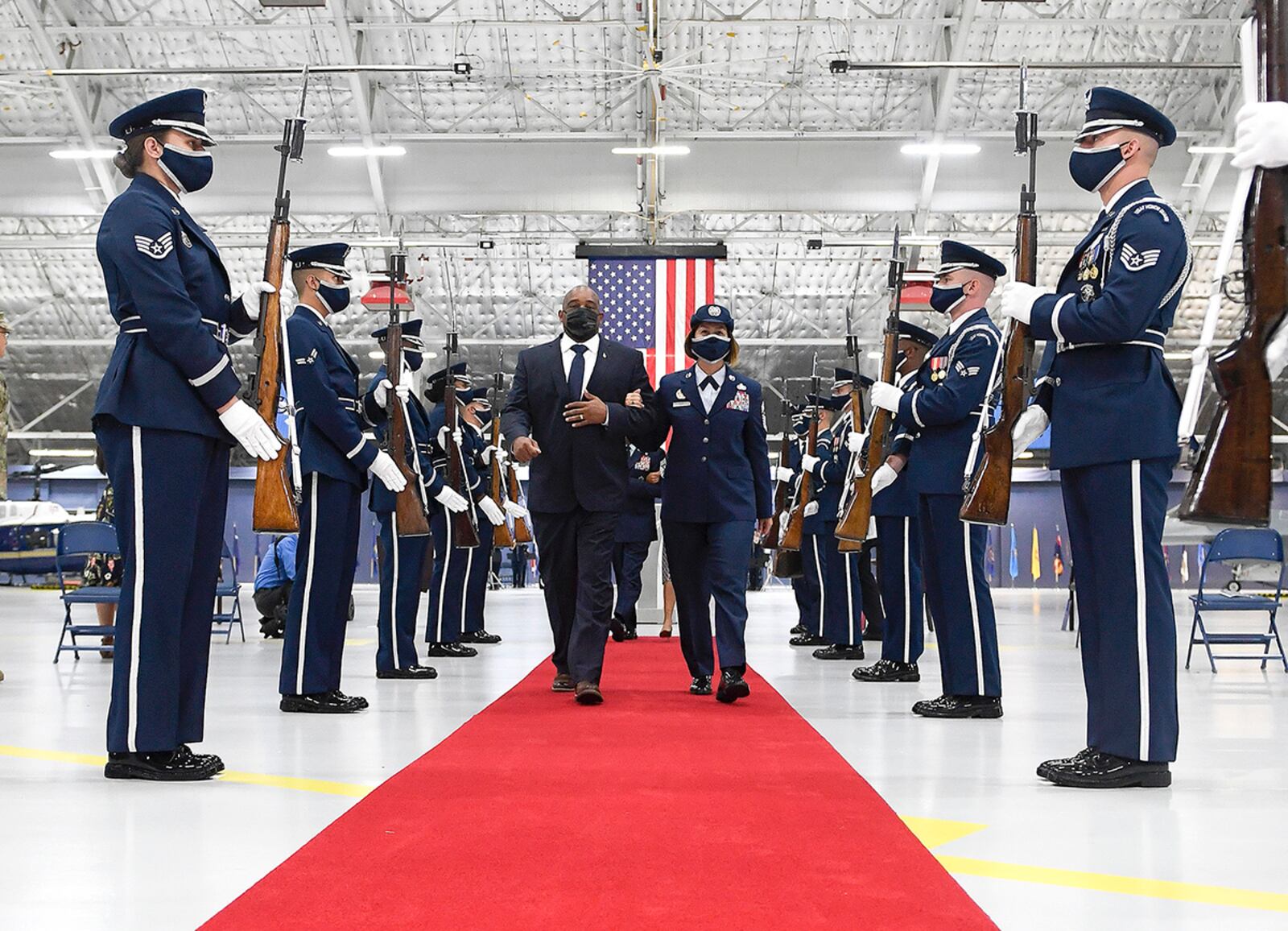 Chief Master Sgt. of the Air Force JoAnne S. Bass and her husband, Rahn Bass, walk arm in arm as they leave the change of responsibility ceremony at Joint Base Andrews, Md., Aug. 14. (U.S. Air Force photo/Andy Morataya)