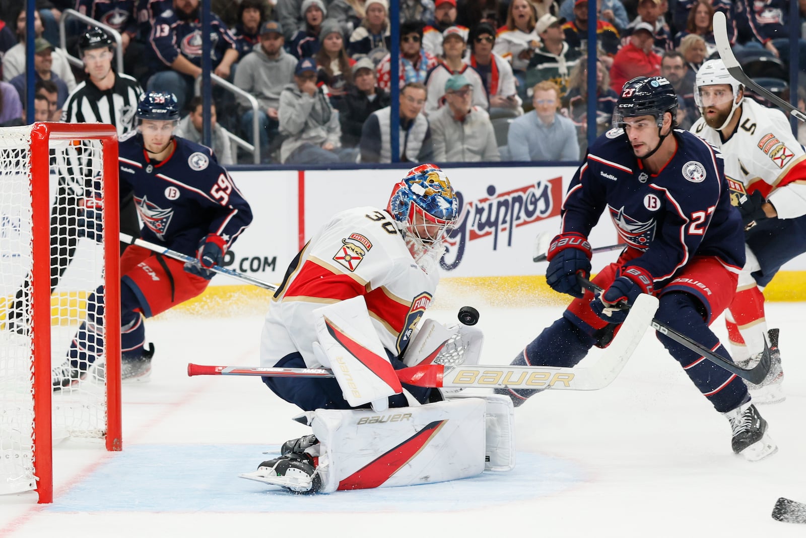 Columbus Blue Jackets' Sean Monahan, right, scores a goal against Florida Panthers' Spencer Knight during the second period of an NHL hockey game Tuesday, Oct. 15, 2024, in Columbus, Ohio. (AP Photo/Jay LaPrete)