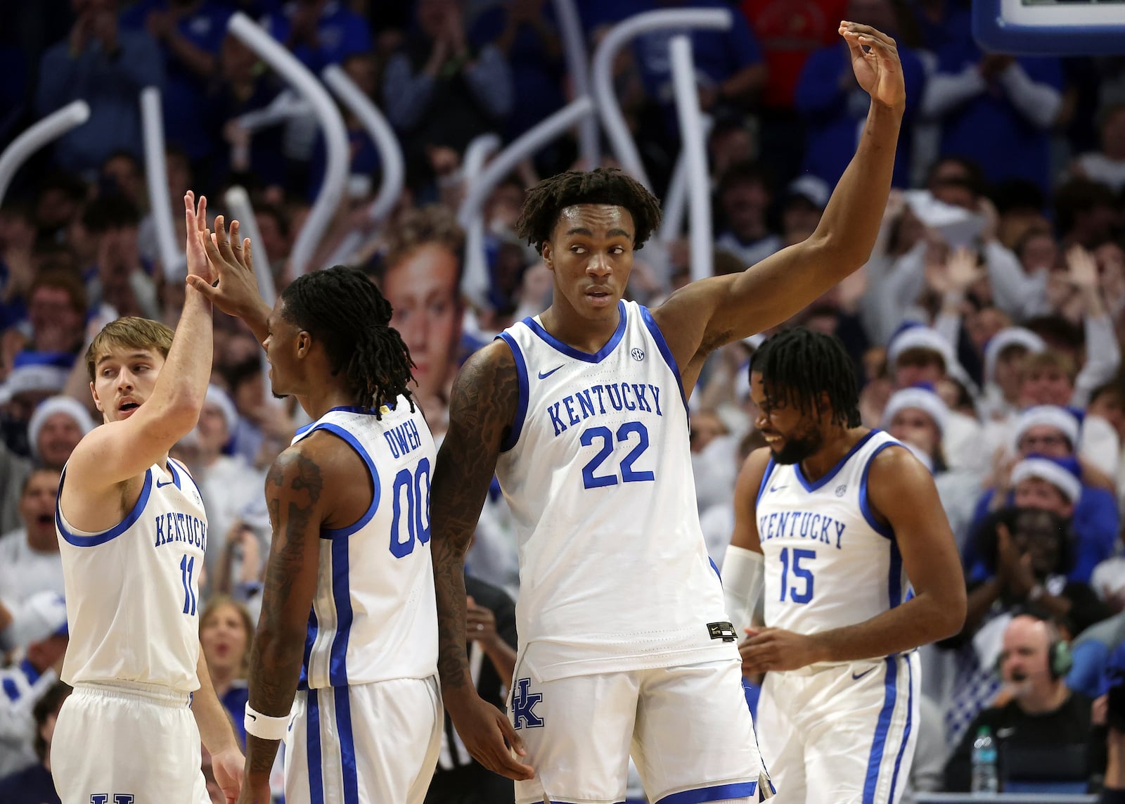 Kentucky's Amari Williams (22) tries to fire up the crowd during the first half of an NCAA college basketball game against Louisville in Lexington, Ky., Saturday, Dec. 14, 2024. (AP Photo/James Crisp)