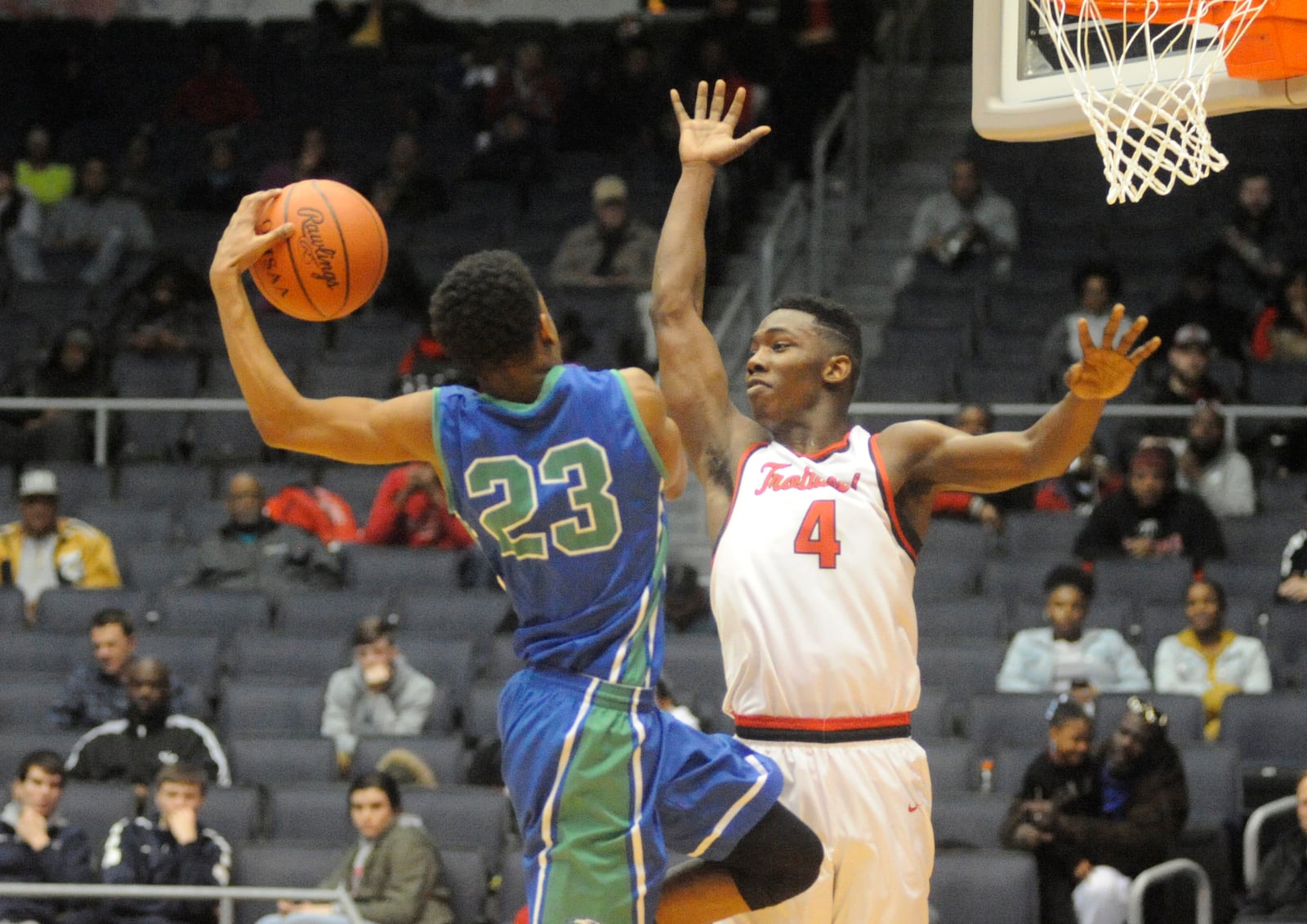 Dominic Wilcox of CJ (with ball) takes on Myles Belyeu of Trotwood-Madison. MARC PENDLETON / STAFF