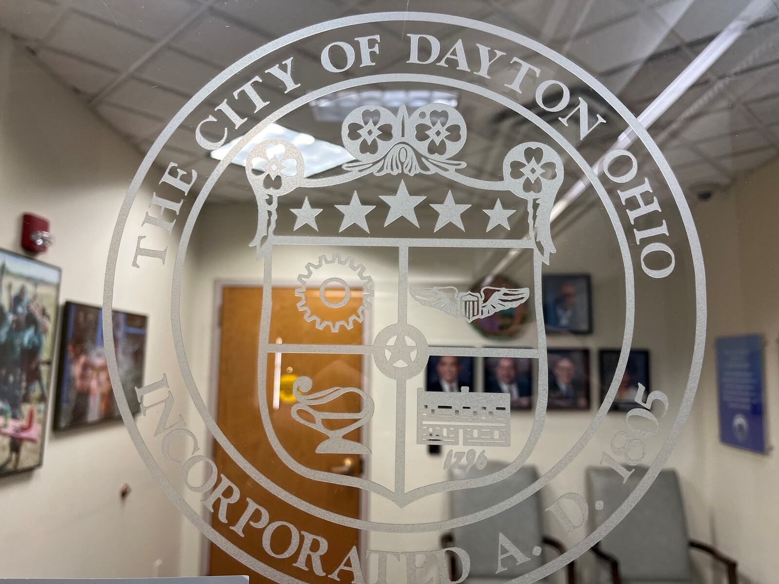 The city of Dayton seal on the door to the offices of the Dayton City Commission. Two commission seats will be up for grabs later this year. CORNELIUS FROLIK / STAFF