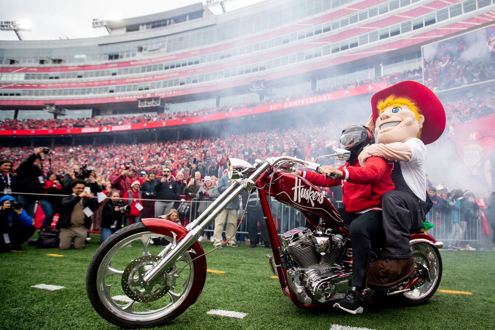 FILE - Nebraska's mascot Herbie Husker arrives on a motorcycle for the Husker's spring NCAA college football game in Lincoln, Neb., Saturday, April 22, 2023. (Anna Reed/Omaha World-Herald via AP, File)