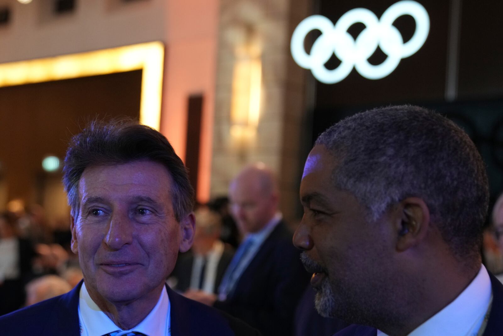 Candidate to the presidency of the International Olympic Committee Sebastian Coe, left, arrives for the 144th session, which will elect the new IOC President, in Costa Navarino, western Greece, Thursday, March 20, 2025. (AP Photo/Thanassis Stavrakis)