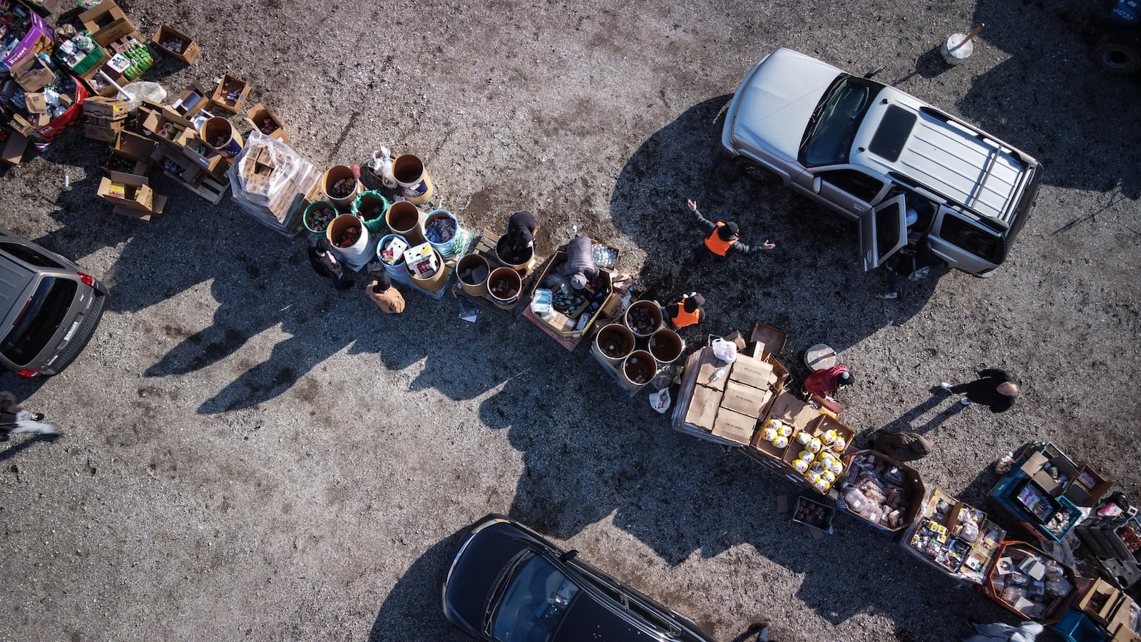 Vehicles lined up to receive food at the Dixie Drive-In on Wednesday Dec. 22, 2021. The Christmas food giveaway was run by the With God's Grace charity group and the Levin Family Foundation. JIM NOELKER/STAFF