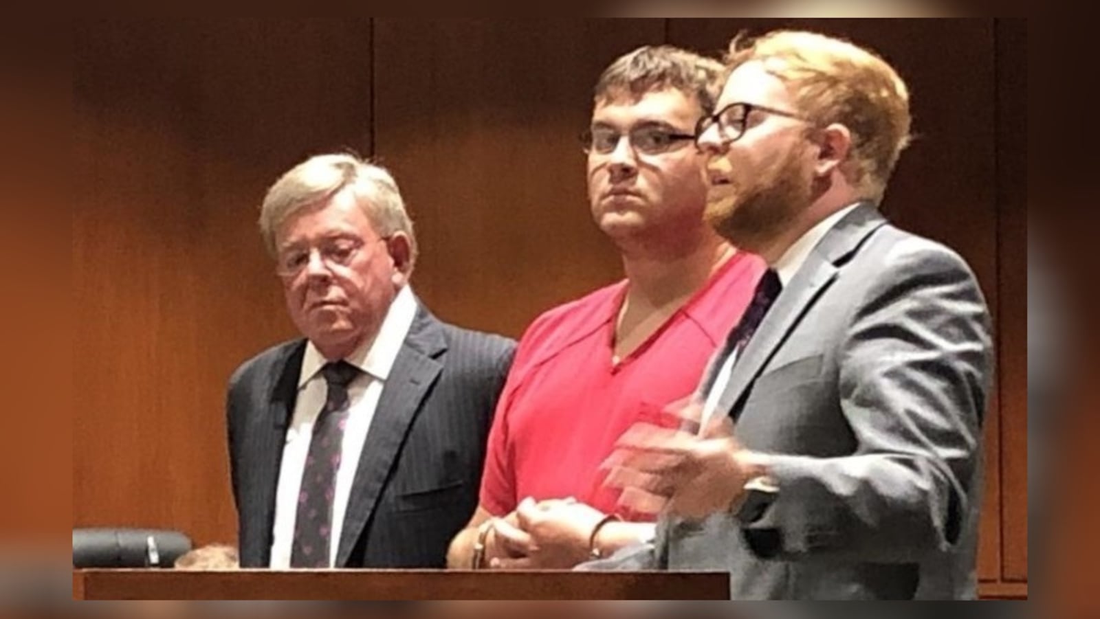 John Austin Hopkins listens as lawyer David Anthony Chicarelli, right, argues for reasonable bail during an earlier hearing in his criminal case. David Allen Chicarelli listens at left. LAWRENCE BUDD / STAFF FILE