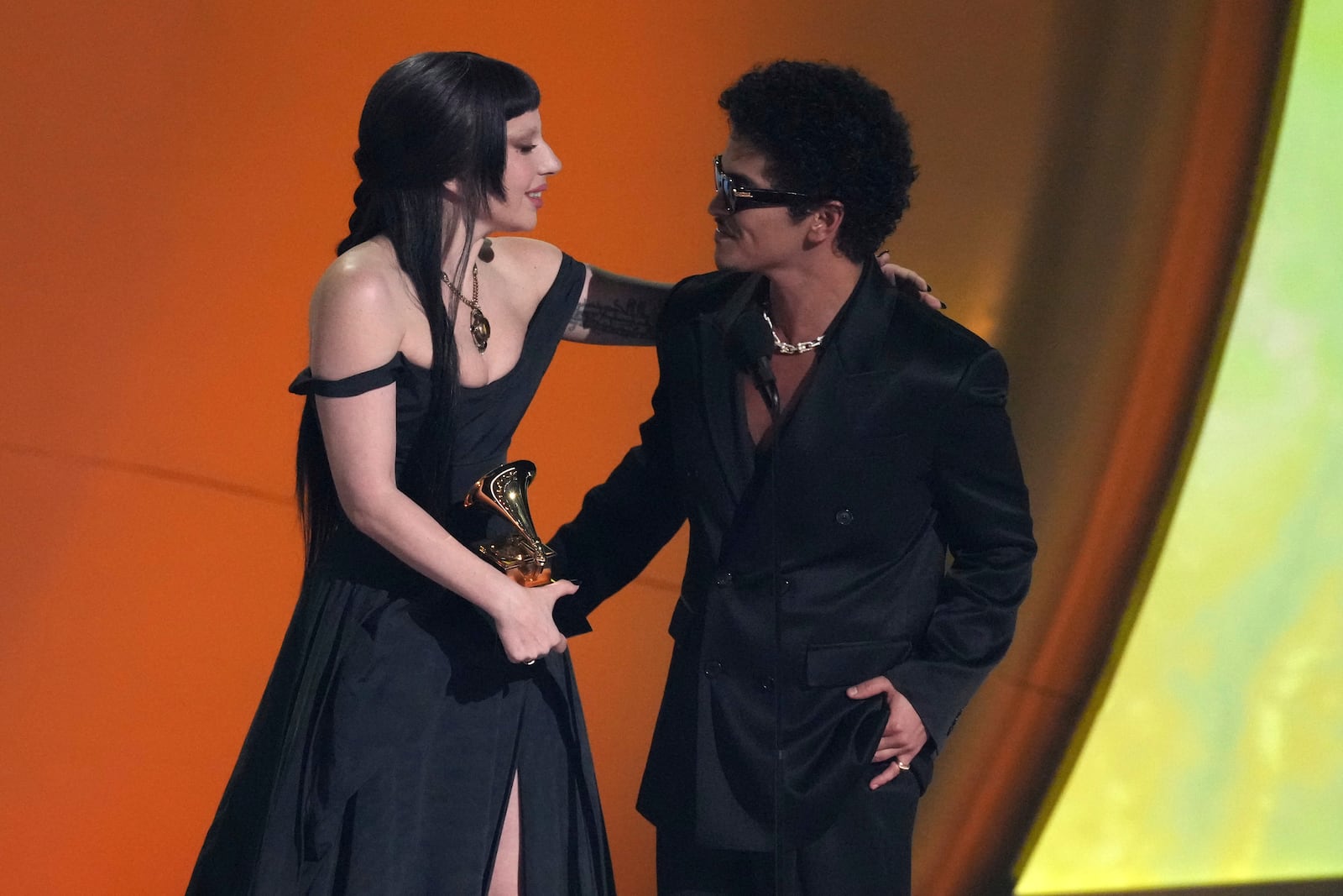 Lady Gaga, left, and Bruno Mars accept the award for best pop duo/group performance for "Die With A Smile" during the 67th annual Grammy Awards on Sunday, Feb. 2, 2025, in Los Angeles. (AP Photo/Chris Pizzello)