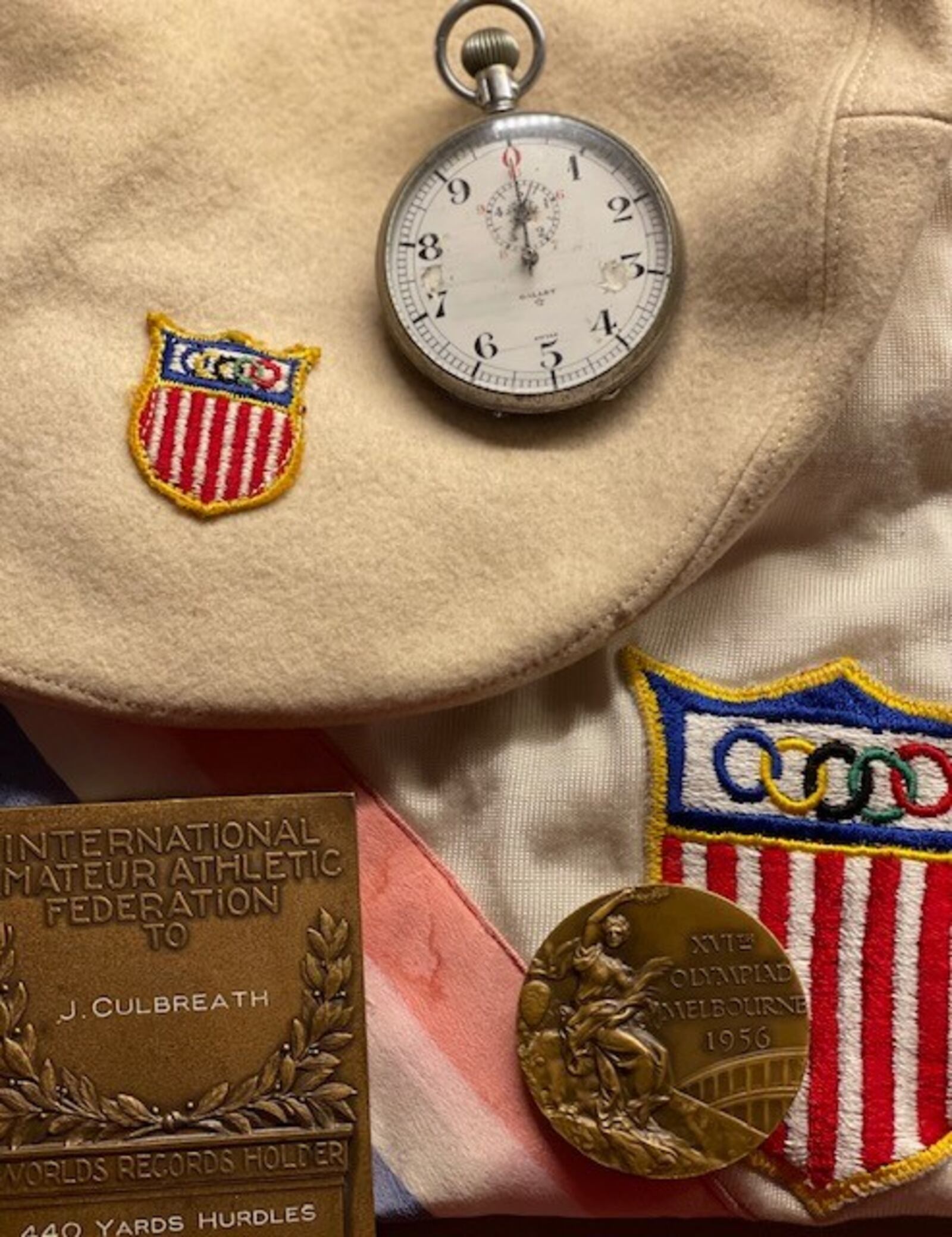 Some of Josh Culbreath's track memorabilia -- (on right) his bronze medal from 1956 Olympics; (on left) his medal from breaking a world record in Oslo in 1957, his Olympics beret and his coaching stopwatch. CONTRIBUTED