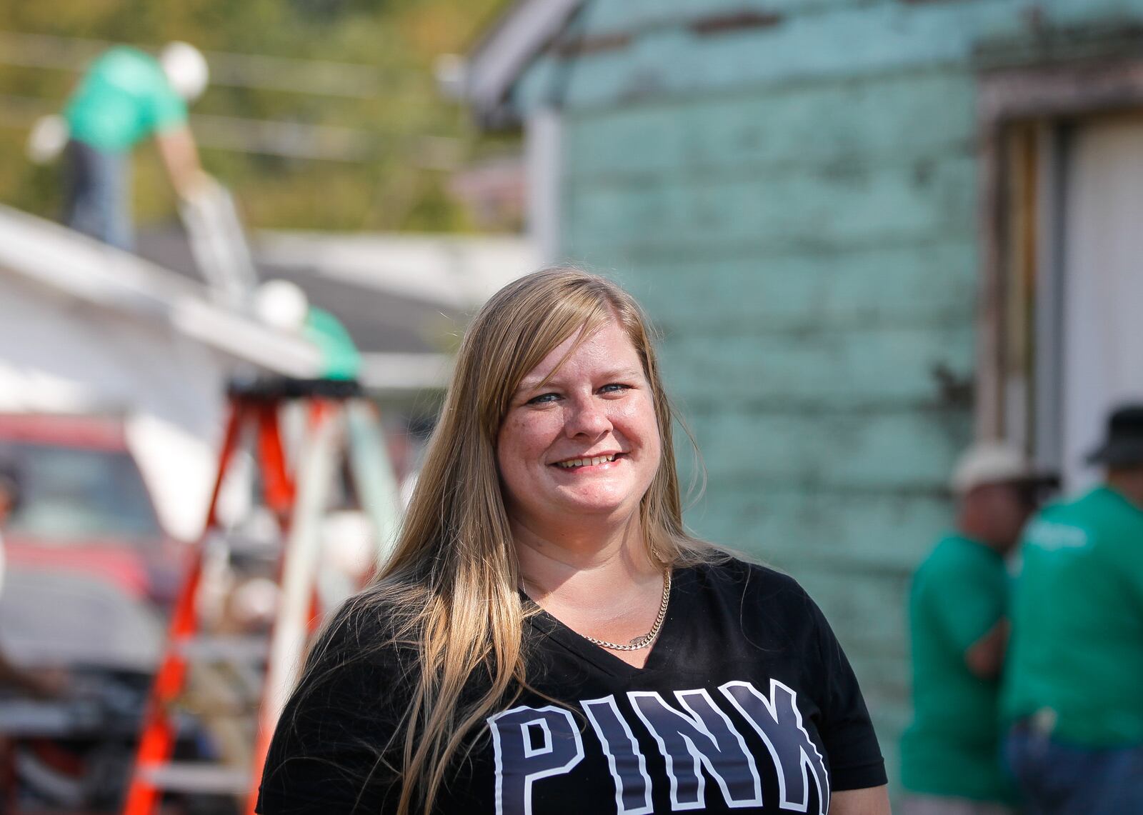 Following her husband's death, Jessica Brady was forced to stop paying homeowners insurance to help make ends meet. Then the home where she still lives with their son Jagger was hit by a Memorial Day tornado. About two dozen Volunteers from Shiloh Church through Rebuilding Together Dayton worked Thursday, Sept. 19, 2019, to help repair the home in Harrison Twp. CHRIS STEWART / STAFF