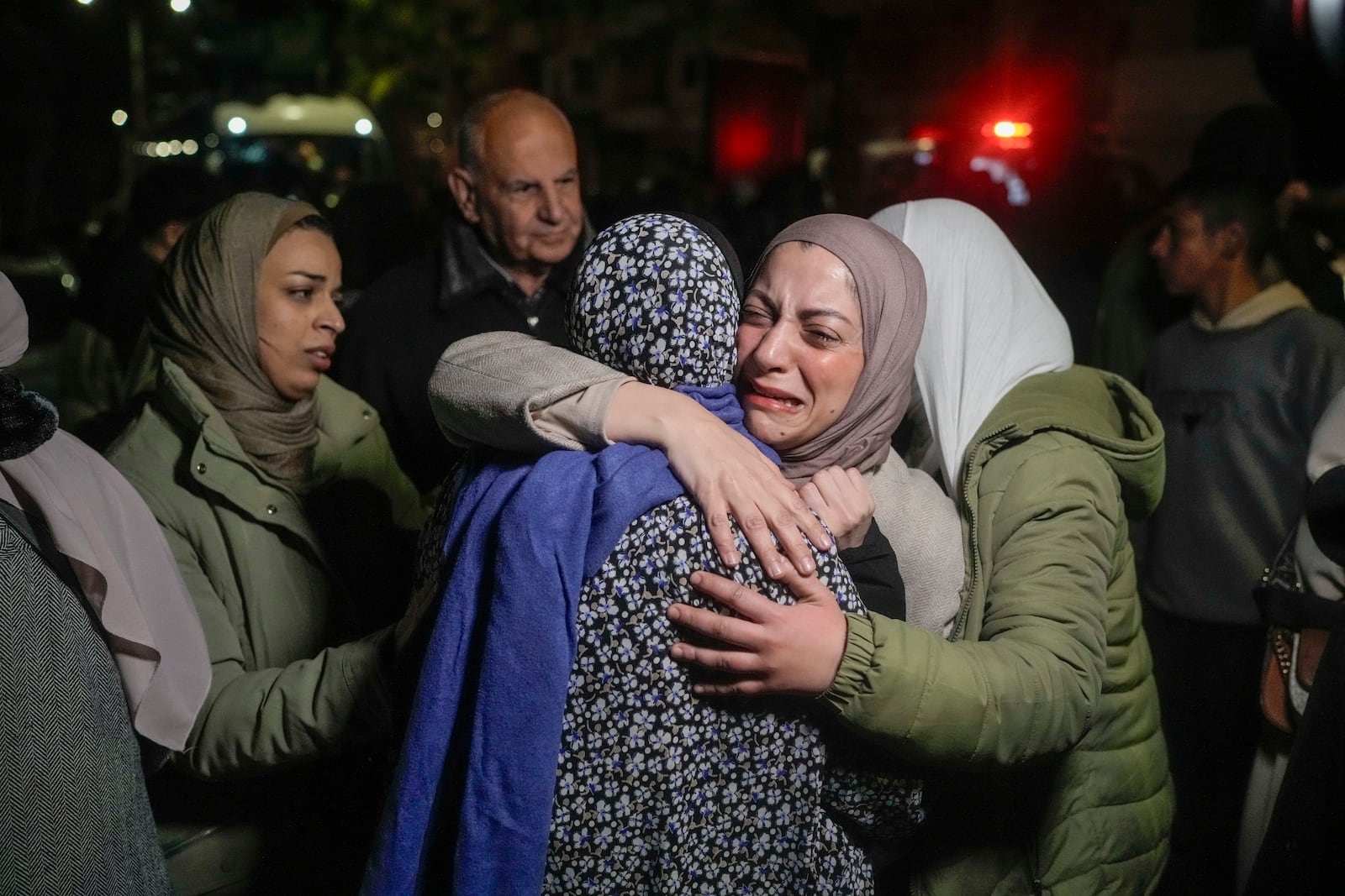 FILE - A female Palestinian prisoner, facing the camera, is greeted after her release from an Israeli prison, in the West Bank city of Beitunia, Jan. 20, 2025. (AP Photo/Leo Correa, File)