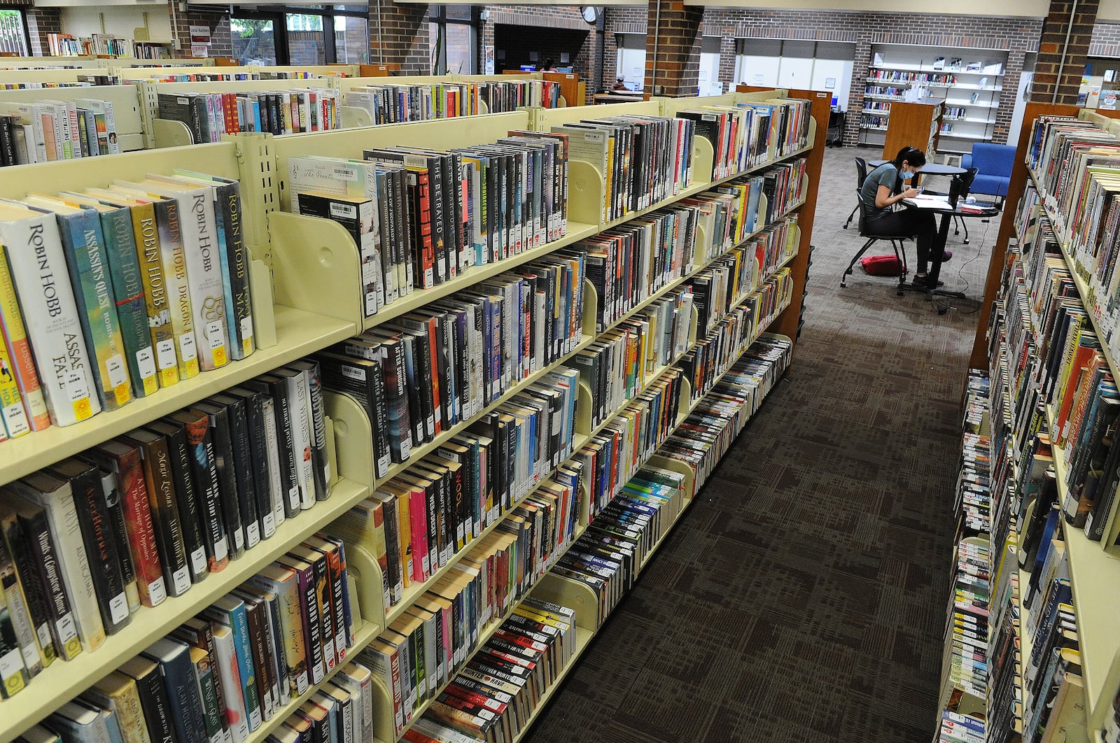 Shelving height and space at the Troy-Miami County Public Library can to challenging to people's mobility issues. MARSHALL GORBY\STAFF