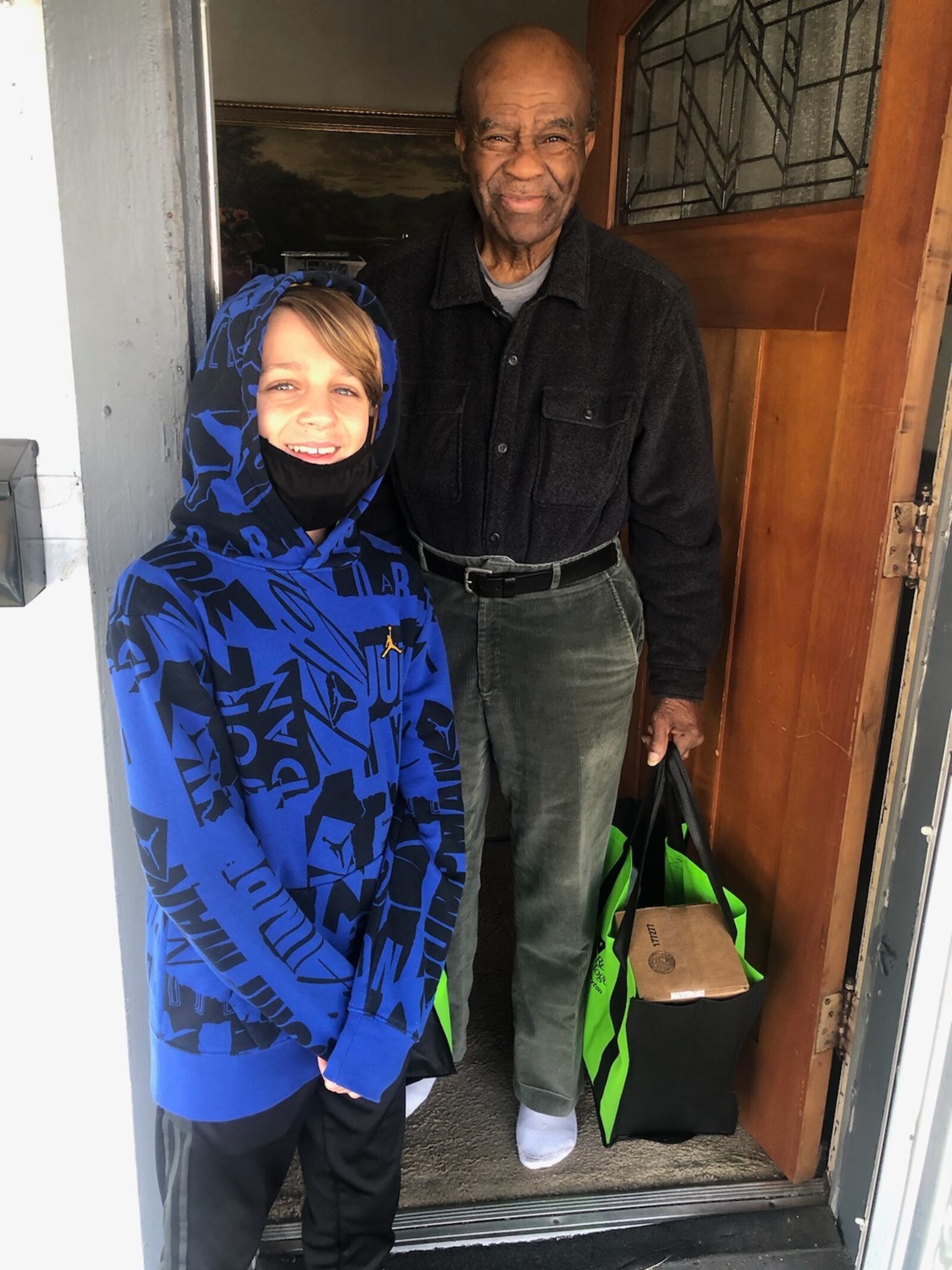 Homeowner Eddie McElroy is pictured with 13-year-old Brody Betts. CONTRIBUTED