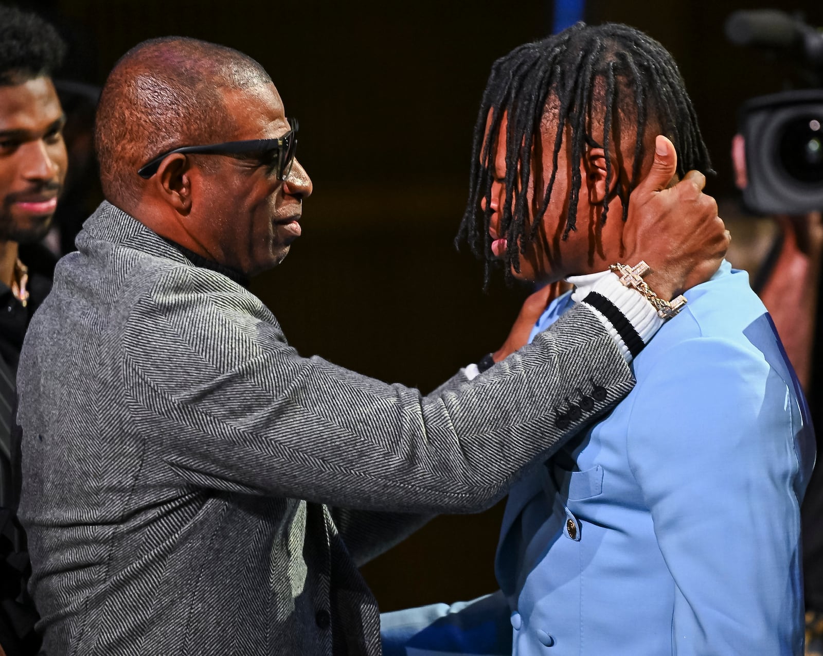 Colorado’s Travis Hunter, right, and coach Deion Sanders embrace after Hunter won the Heisman Trophy as the outstanding player in college football, Saturday, Dec. 14, 2024, in New York. (Todd Van Emet/Heisman Trust via AP, Pool)