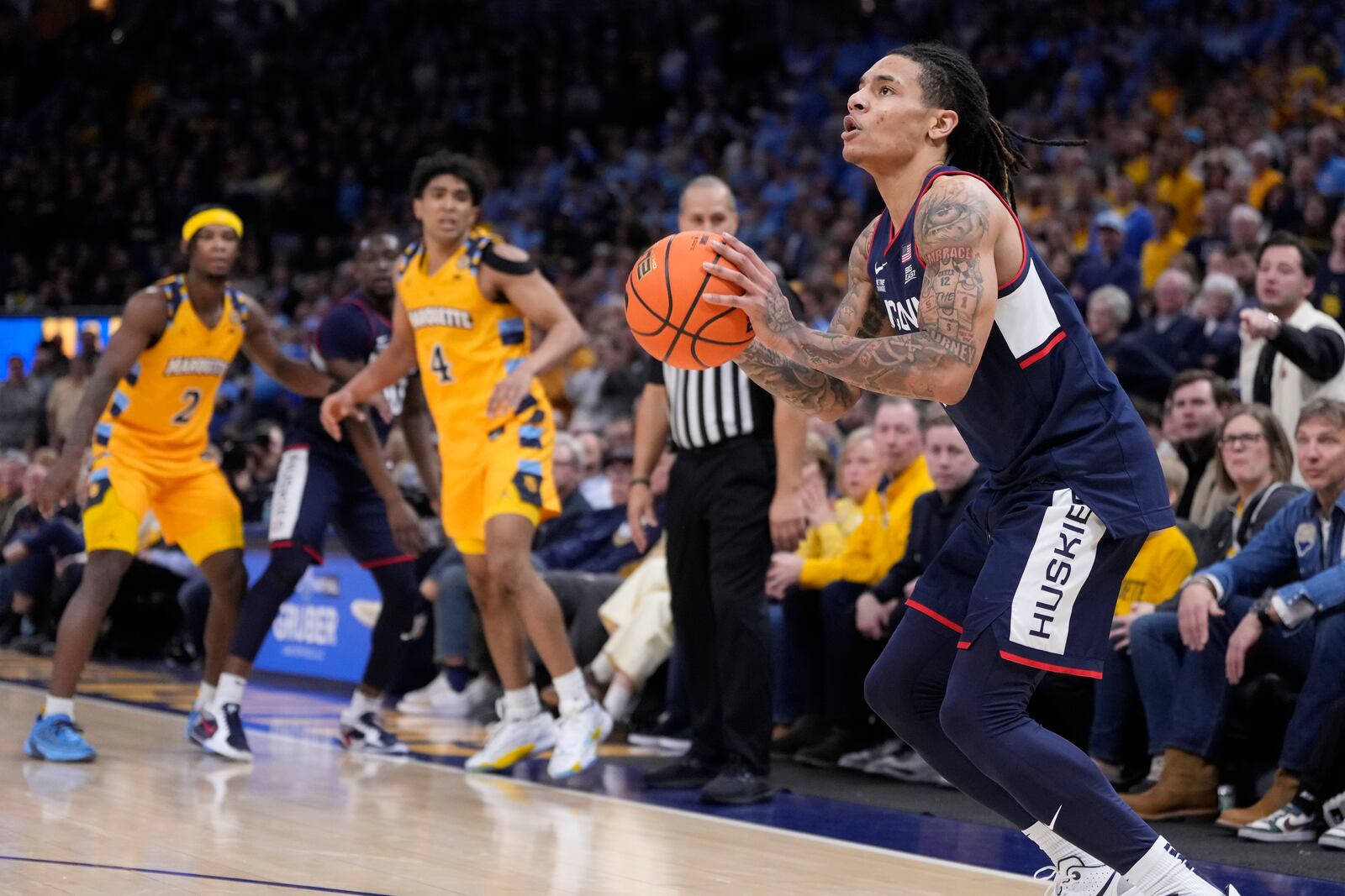 UConn's Solo Ball shoots a three pointer during the second half of an NCAA college basketball game against Marquette Saturday, Feb. 1, 2025, in Milwaukee. (AP Photo/Morry Gash)