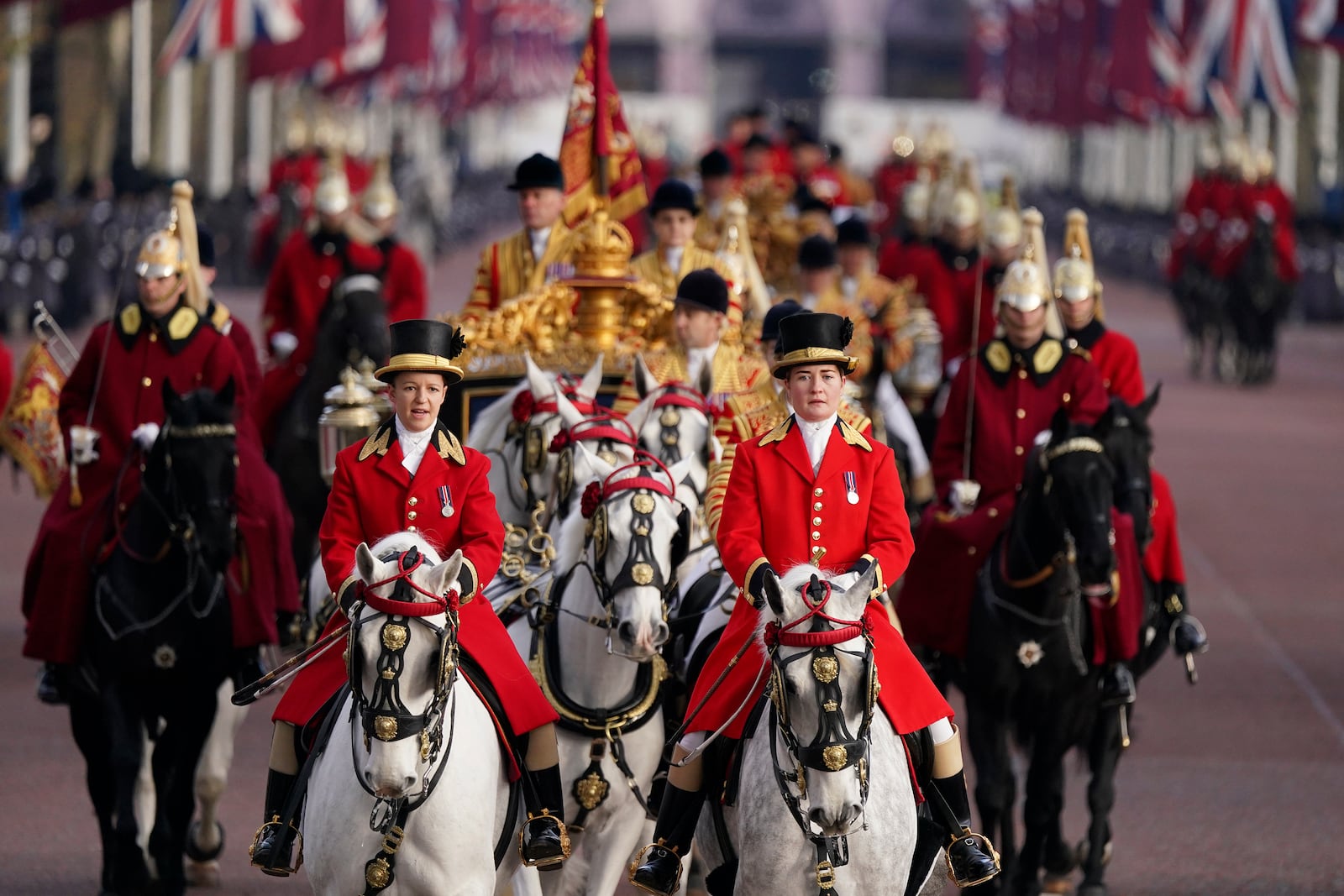 A carriage procession along The Mall to welcome the Emir of the State of Qatar Sheikh Tamim bin Hamad Al Thani and Sheikha Jawaher bint Hamad bin Suhaim Al Thani in London, Tuesday, Dec. 3, 2024. (AP Photo/Alberto Pezzali)