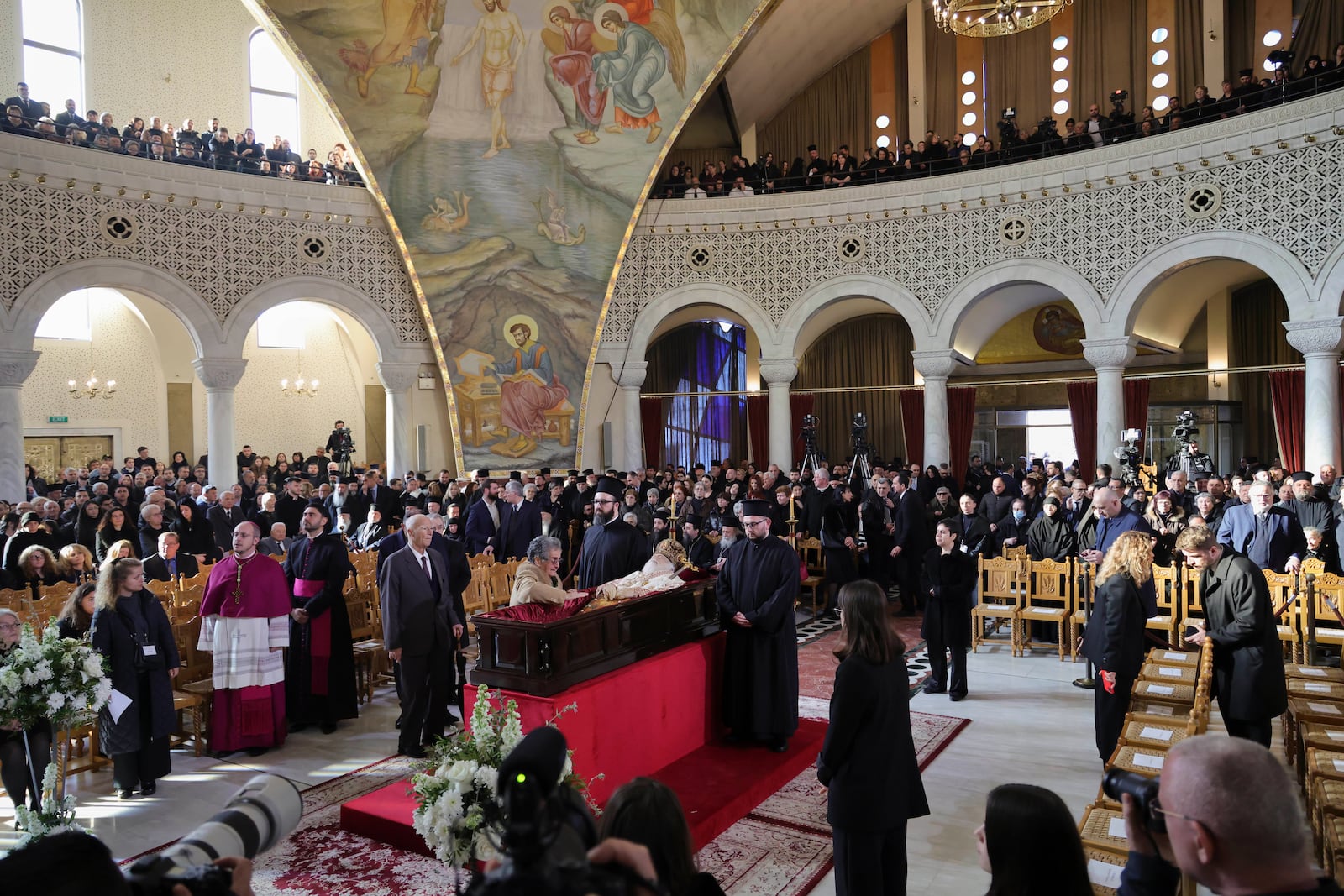 People pay respects to the late Archbishop Anastasios of Tirana, Durres and All Albania during his funeral, inside the Cathedral of the Resurrection of Christ, in Tirana, Albania, Thursday, Jan. 30, 2025. (AP Photo/Vlasov Sulaj)