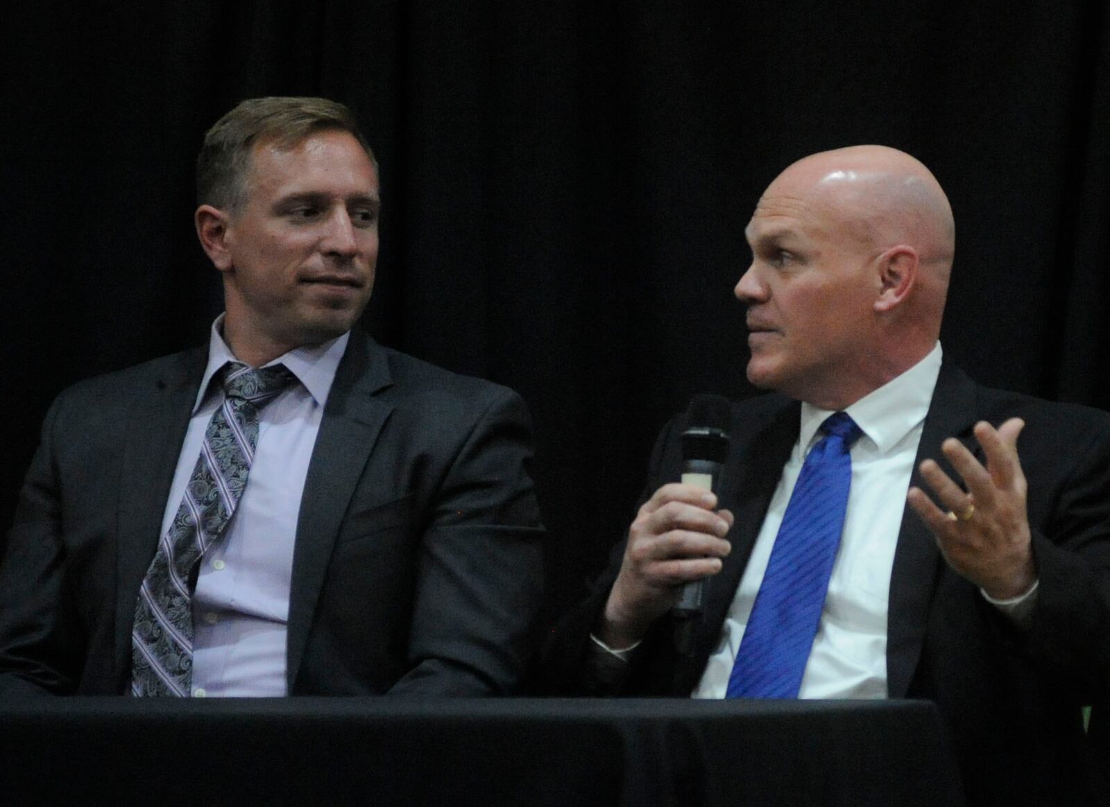 Fairmont coach Dave Miller (right) and Centerville's Brent Ullery addressed a wide range of topics during the Sonny Unger memorial scholarship banquet at Fairhaven Church in Centerville on Tuesday, May 8, 2018. MARC PENDLETON / STAFF