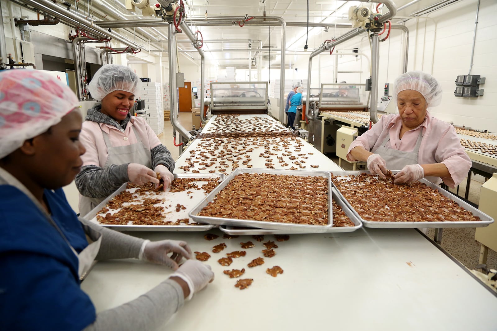 Many of the handmade processes Esther Price originated are still used today at the Esther Price Fine Chocolates factory on Wayne Avenue in Dayton. LISA POWELL / STAFF