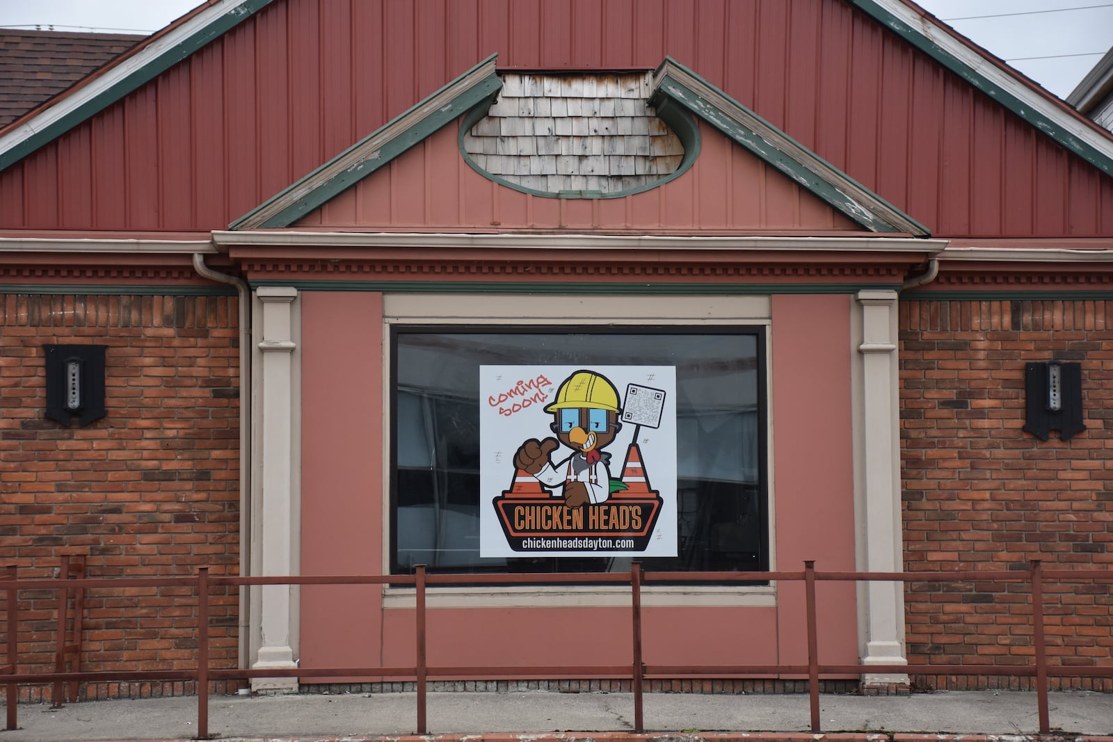 A "coming soon" sign hangs in the window of the vacant commercial building at 865 N. Main St. in Dayton. Anthony Head, owner of Chicken Spot LLC, has proposed to open a new restaurant called Chicken Head's at this location. The city of Dayton awarded the project $178,000 in funding but has told Head it is terminating the grant agreement and wants some of its grand funding returned. CORNELIUS FROLIK / STAFF