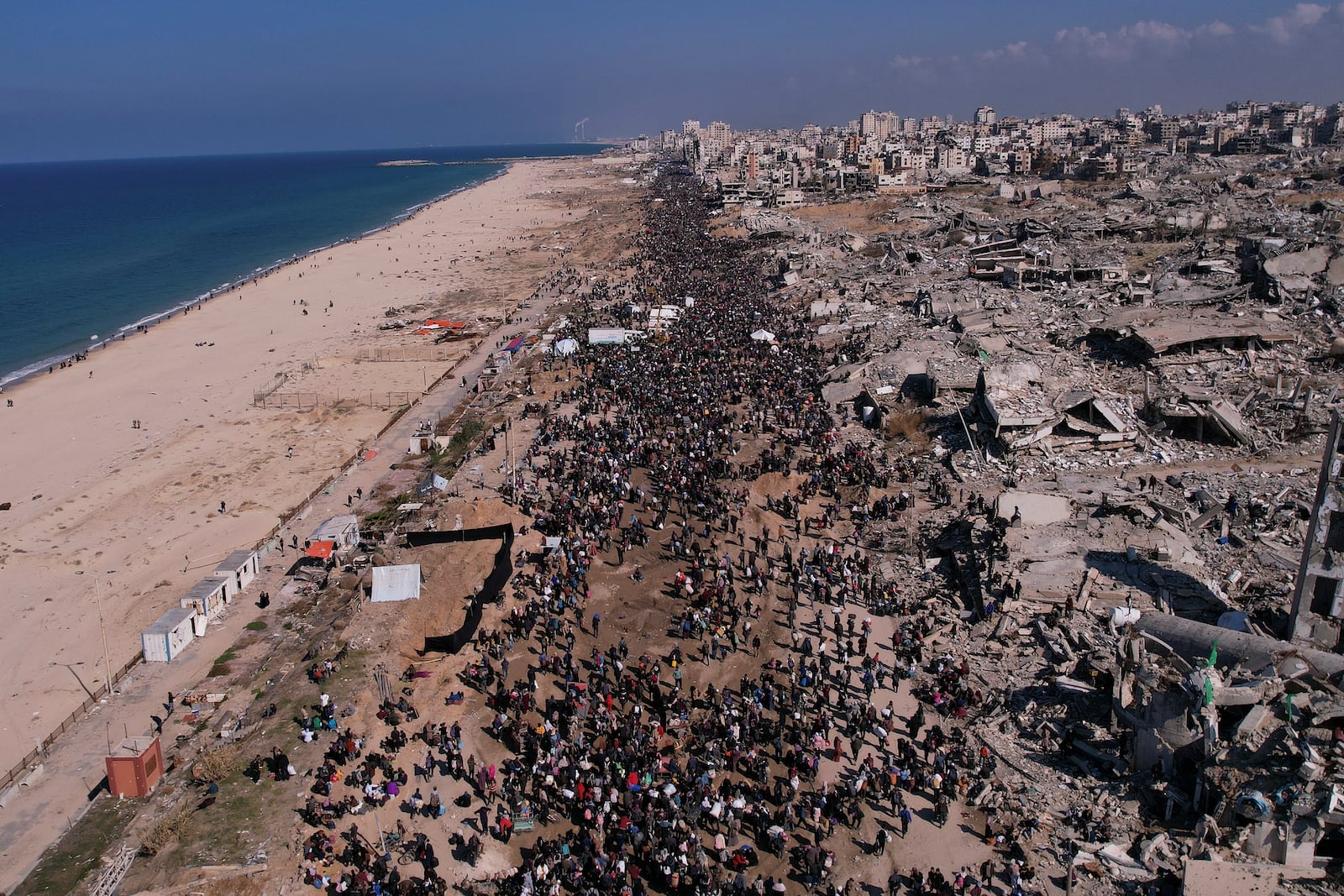 Displaced Palestinians return to their homes in the northern Gaza Strip on Monday, Jan. 27, 2025, following Israel's decision to allow thousands of them to go back for the first time since the early weeks of the 15-month war with Hamas. (AP Photo/Mohammad Abu Samra)