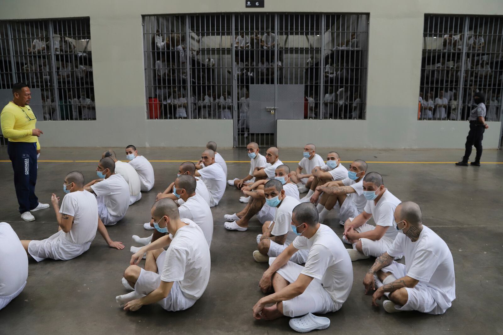 FILE - Inmates attend class on social behavior during a press tour of the Terrorism Confinement Center, or CECOT, in Tecololuca, El Salvador, Thursday, Oct. 12, 2023. Inmates wear masks as a precaution to not spread COVID-19. (AP Photo/Salvador Melendez, File)