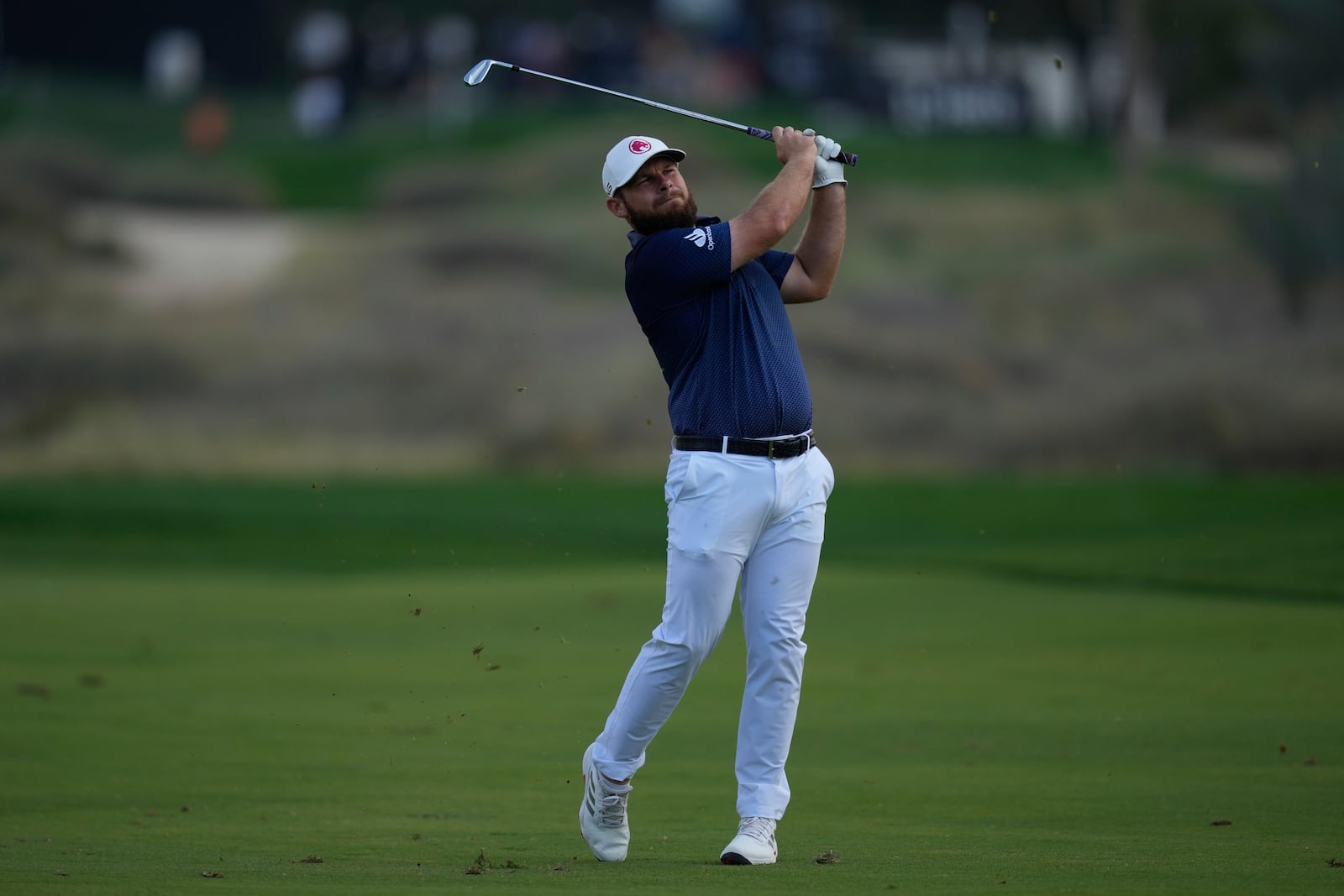 Tyrell Hatton of England plays his second shot on the 16th hole during the final round of the Dubai Desert Classic golf tournament, in Dubai, United Arab Emirates, Sunday, Jan. 19, 2025. (AP Photo/Altaf Qadri)