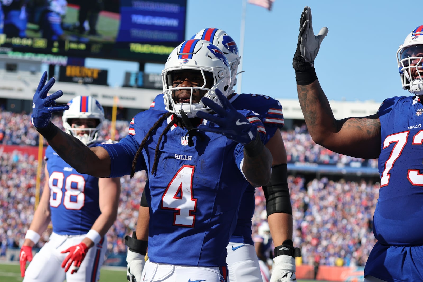 Buffalo Bills running back James Cook (4) celebrates a touchdown against the Tennessee Titans during the first half of an NFL football game Sunday, Oct. 20, 2024, in Orchard Park, N.Y. (AP Photo/Jeffrey T. Barnes)