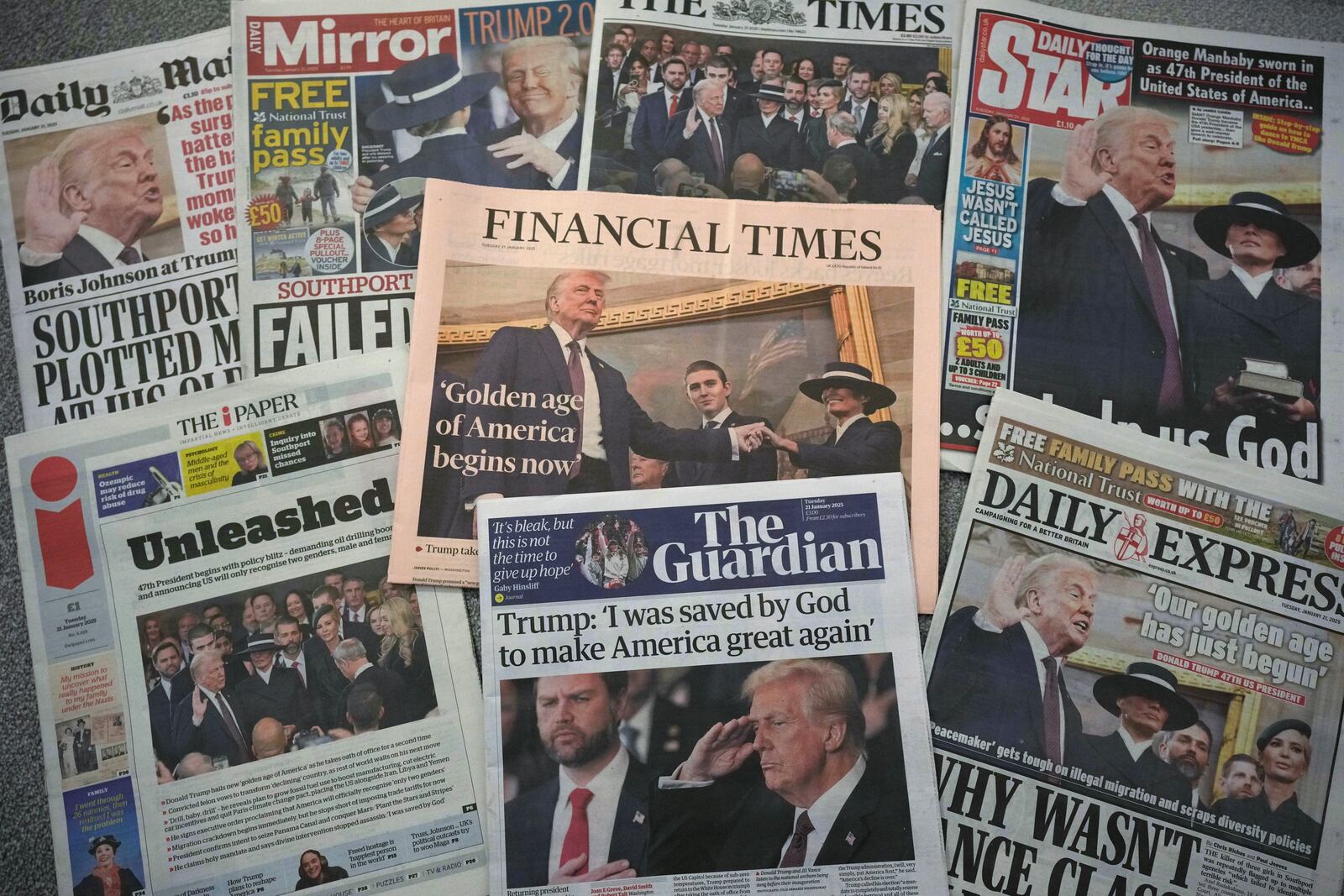 A selection of British national newspaper front pages showing reaction to President Trump's Inauguration in London, Tuesday, Jan. 21, 2025. (AP Photo/Alastair Grant)