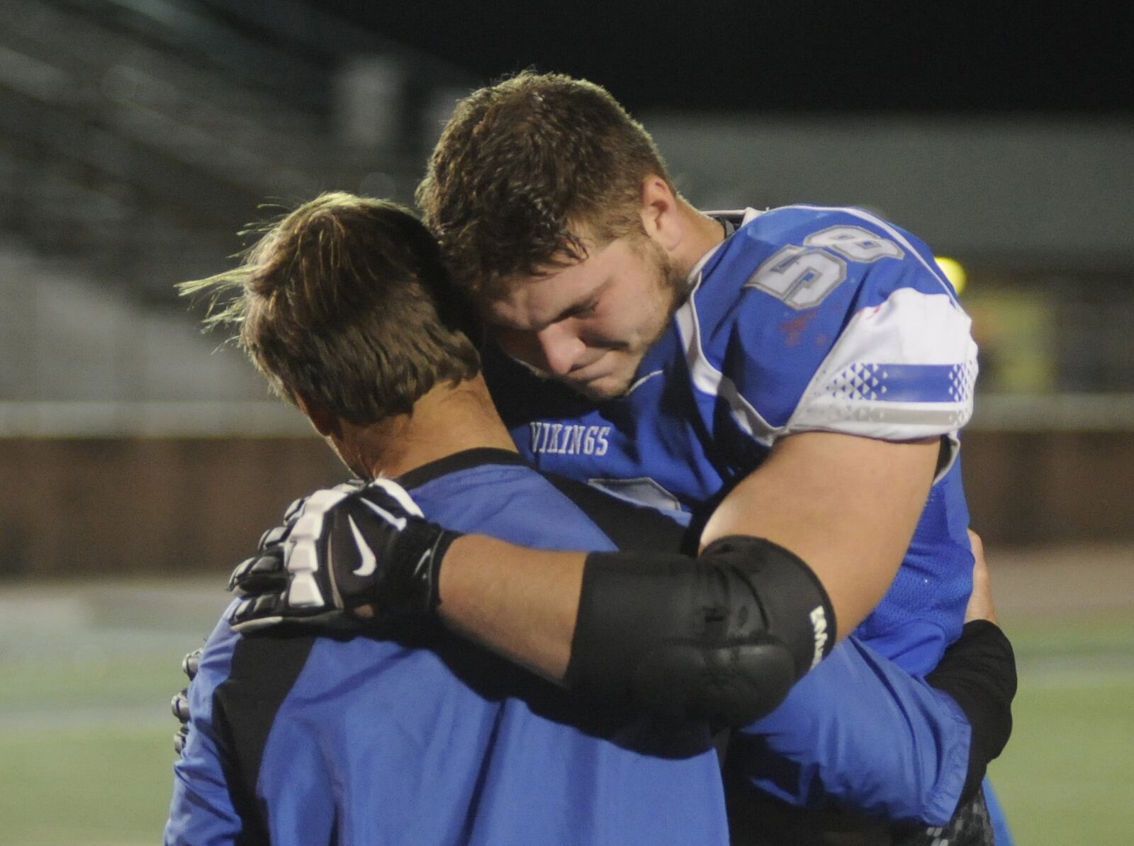 Miamisburg coach Steve Channell and senior OL Josh Myers. Cincinnati La Salle defeated Miamisburg 45-14 in a D-II, Region 8 high school football final at Mason on Friday, Nov. 18, 2016. MARC PENDLETON / STAFF