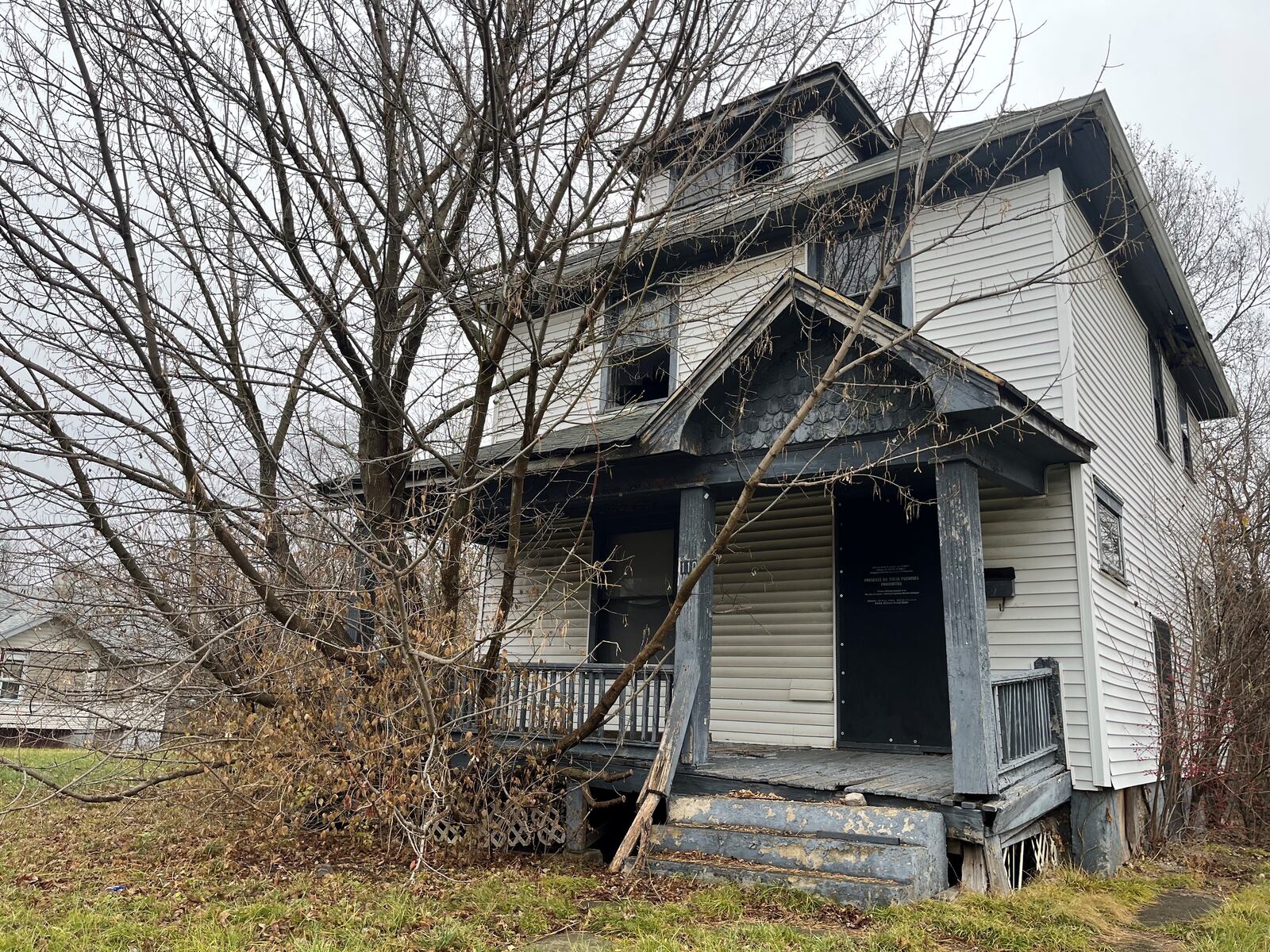 A home at 110 Huron Ave. on the city of Dayton's nuisance list. Neighbors say the eyesore attracts unwanted trespassers and activities. CORNELIUS FROLIK / STAFF