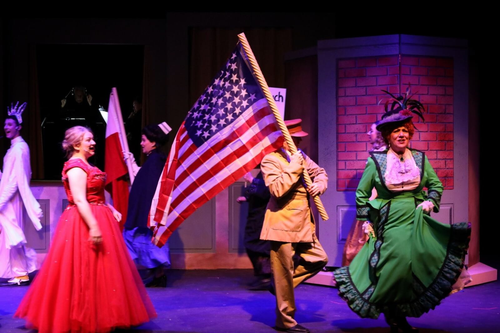 left to right: Krissy McKim-O'Malley (ensemble), Jeffrey Murphy (ensemble) and Tina McPhearson (Dolly Levi) in Dayton Playhouse's production of "Hello, Dolly!" PHOTO BY RICK FLYNN PHOTOGRAPHY