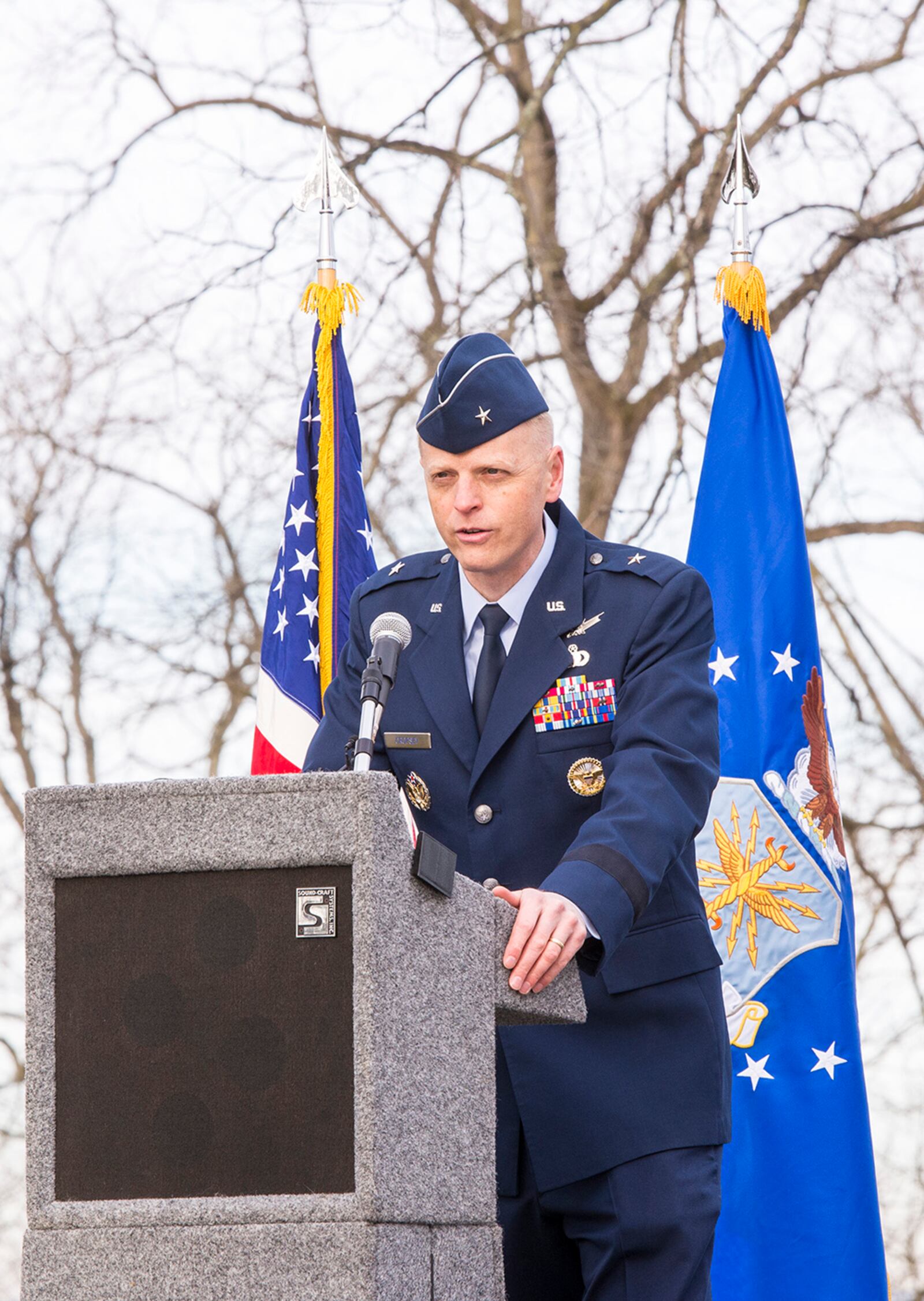 Brig. Gen. Luke Cropsey, director of the Air Force Security Assistance and Cooperation Directorate, gives the keynote address during the 118th First Flight anniversary Dec. 17 at Wright-Patterson Air Force Base. U.S. AIR FORCE PHOTO/JAIMA FOGG