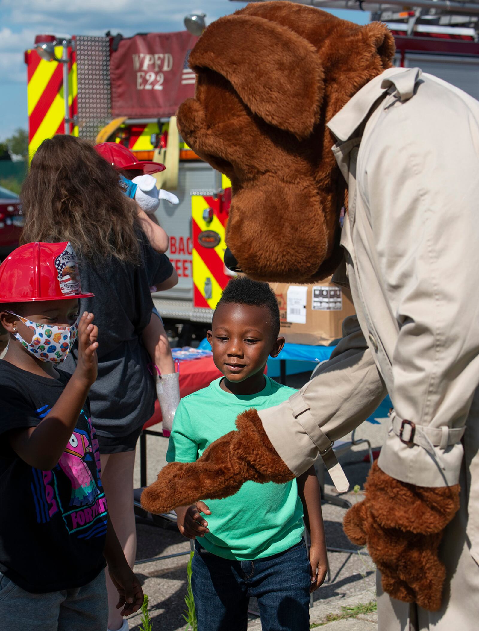 Terron Stanley (left), 7, and R.J. Brown, 5, meet McGruff the Crime Dog on Aug. 3 during National Night Out at Wright-Patterson Air Force Base. Terron is the son of Senior Airman Andaiye Broussard-Marion, U.S. Air Force School of Aerospace Medicine, and R.J. is the son of Reginald Brown. U.S. AIR FORCE PHOTO/R.J. ORIEZ