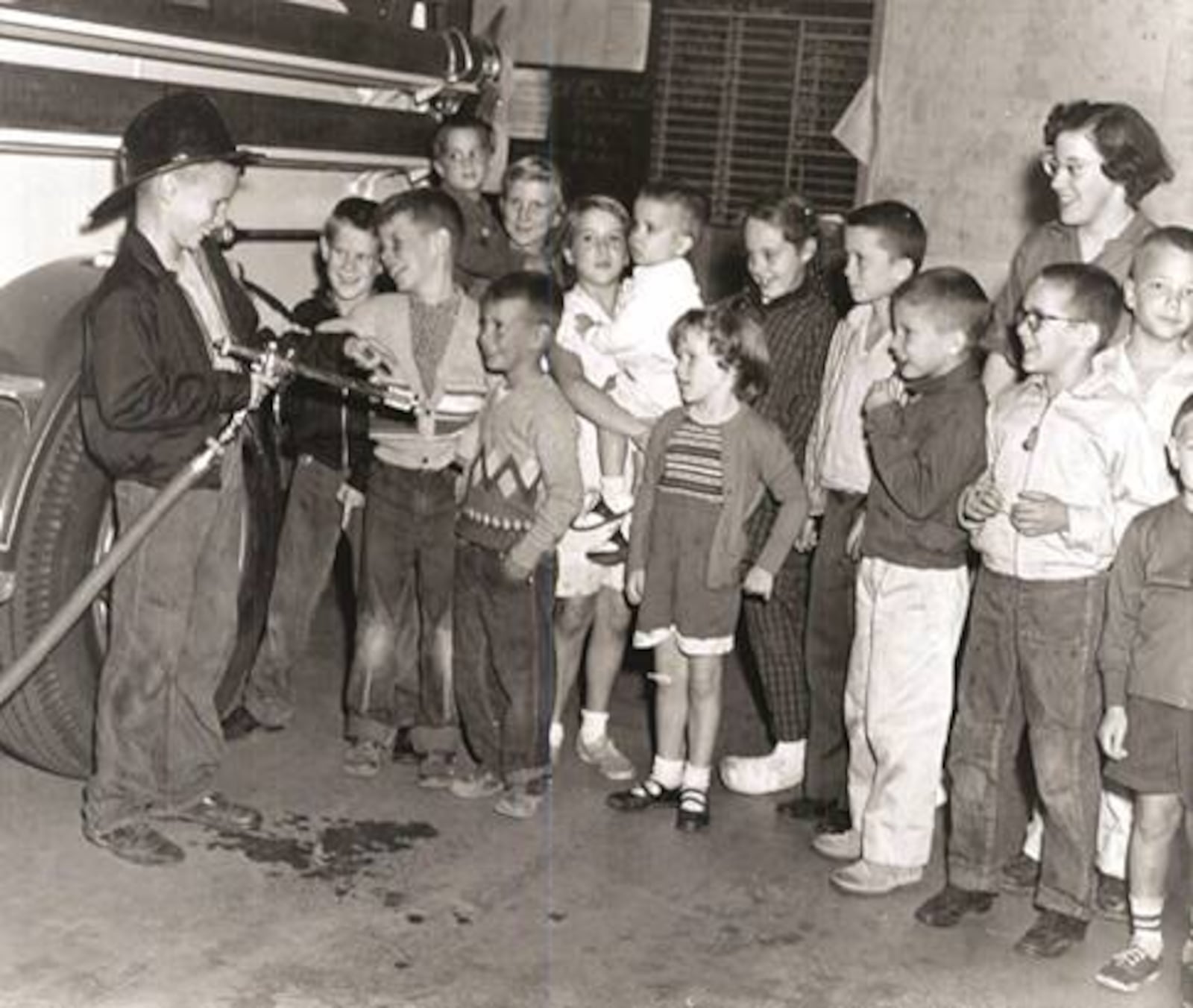 Youngsters get some hands-on lessons with equipment during a visit to the Kettering Fire Department. CONTRIBUTED