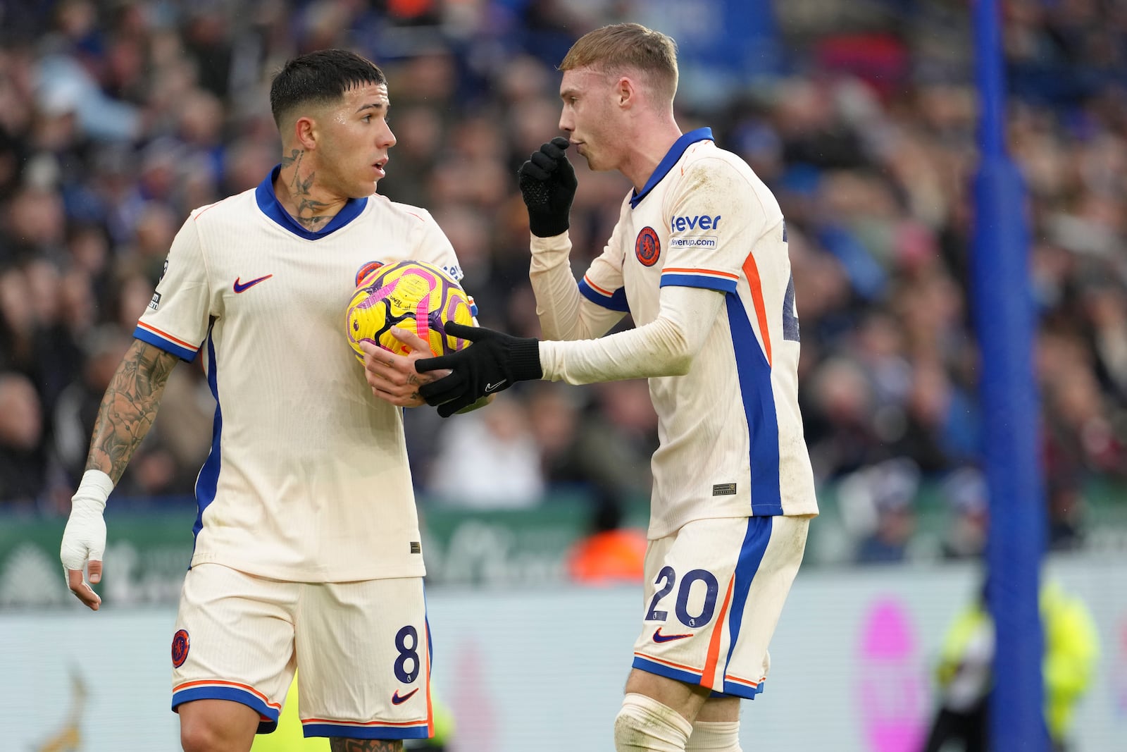 Chelsea's Enzo Fernandez, left, and Cole Palmer interact during the English Premier League soccer match between Leicester City and Chelsea at King Power stadium in Leicester, England, Saturday, Nov. 23, 2024. (AP Photo/Dave Shopland)