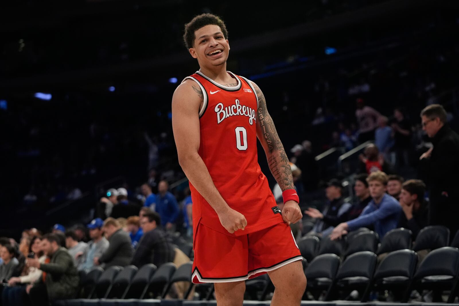 Ohio State's John Mobley Jr. (0) celebrates during the second half of an NCAA college basketball game against Kentucky in the CBS Sports Classic, Saturday, Dec. 21, 2024, in New York. (AP Photo/Frank Franklin II)