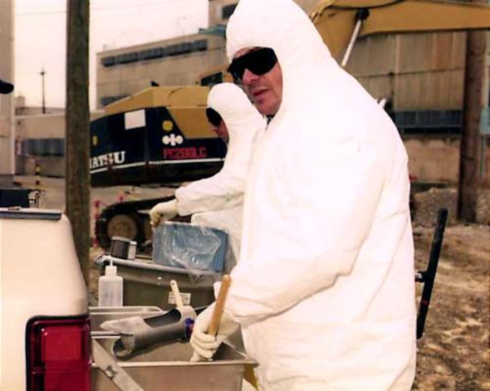 Workers take soil samples to analyze for radioactivity at the former location of a dismantled incinerator, known as the Radicator, at the Portsmouth Gaseous Diffusion Plant in Piketon, Ohio.