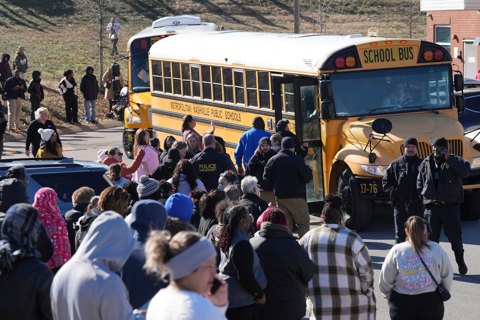 School bus arrives at a unification site following a shooting at at Antioch High School in Nashville, Tenn., Wednesday, Jan. 22, 2025. (AP Photo/George Walker IV)