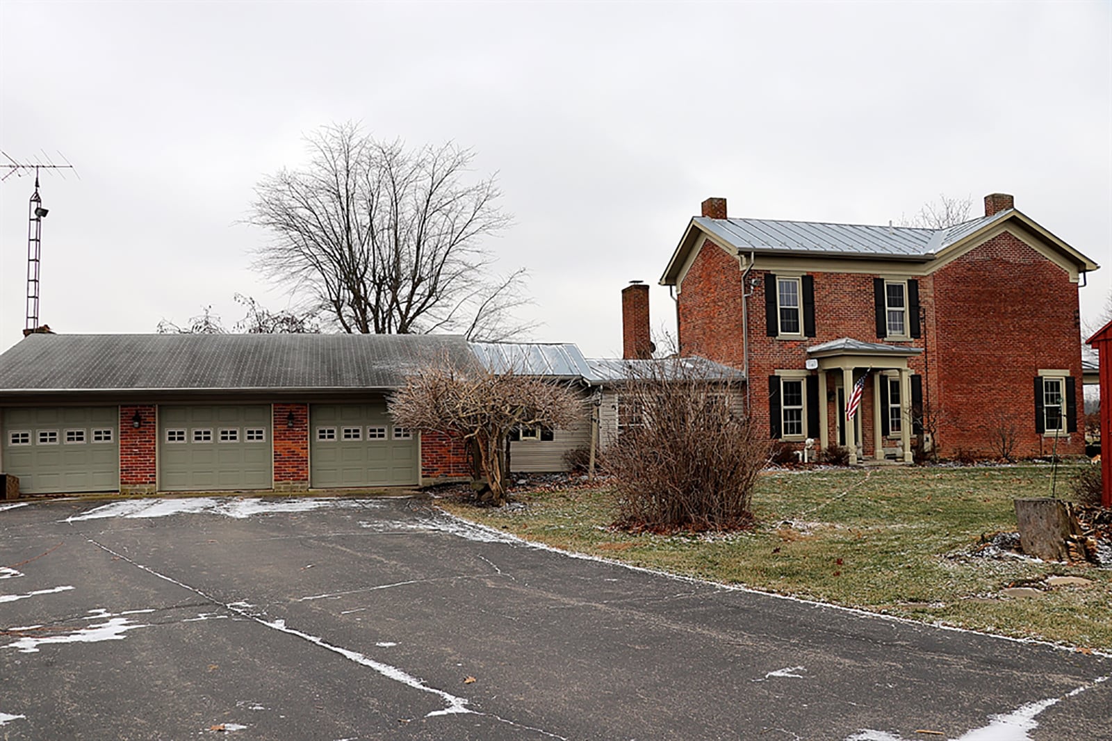 A paved driveway weaves its way to the front porch of the homestead and back through two outbuildings to the 3-car garage. CONTRIBUTED PHOTO BY KATHY TYLER