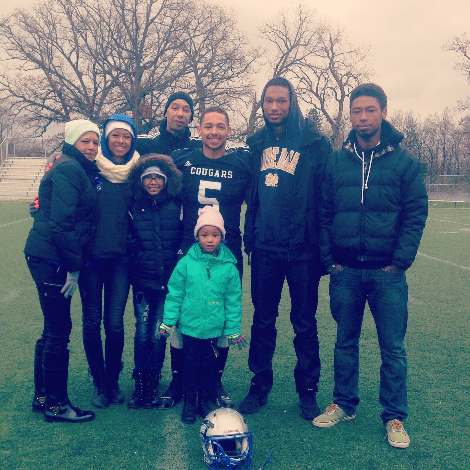 The Campbell family from left, Erin (mom) Cameron, Lauren (sister), Fred (dad in back),  Antoin (brother, wearing No 5 jersey), Aaron (brother) and Jalen (brother).  In front: Kristen (sister.) The family had gathered to celebrate Antoin, who was being inducted in the Springboro Athletic Hall of Fame.